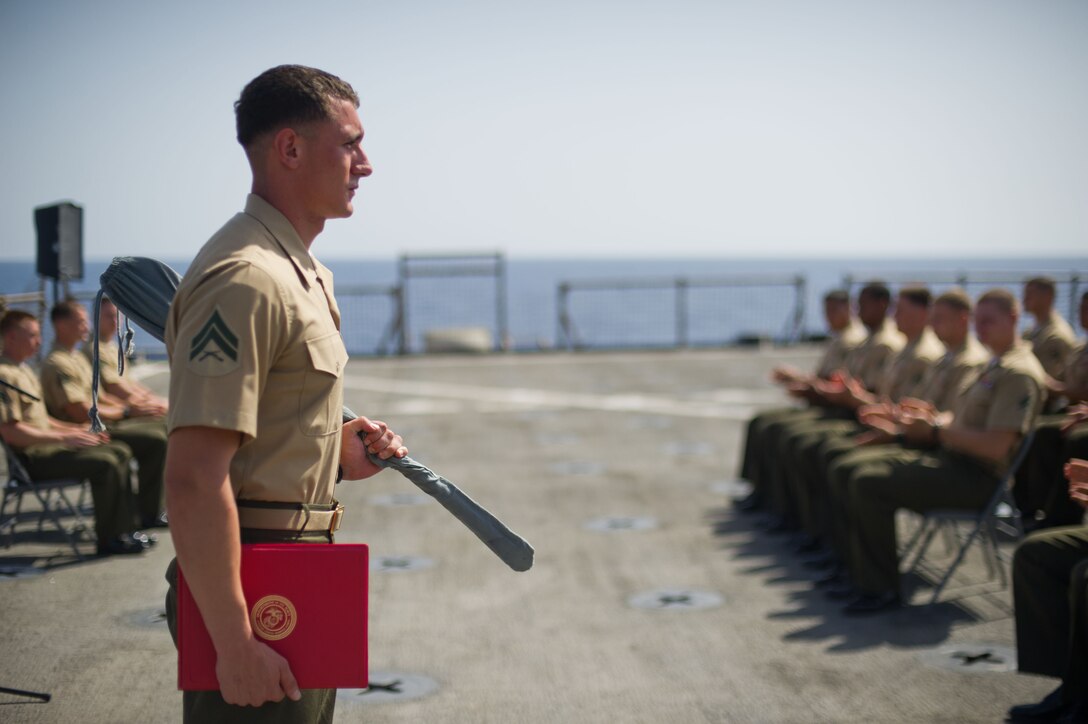 Cpl. Neil O. Garity receives a noncommissioned officer sword aboard USS Pearl Harbor May 1 after completing formal NCO leadership training. The 23-year-old hails from Geneva, Ill., and serves as a mortarman for Weapons Company, Battalion Landing Team 3/1. The team is the ground combat element for the 11th Marine Expeditionary Unit, which is deployed as part of the Makin Island Amphibious Ready Group, currently a U.S. Central Command theater reserve force. The group is providing support for maritime security operations and theater security cooperation efforts in the U.S. Navy's 5th Fleet area of responsibility.