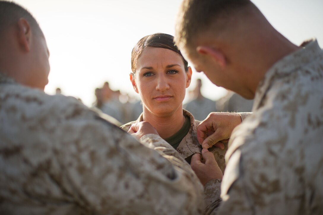 Cpl. Rebecca Fleming is promoted to her present rank during a ceremony aboard USS Pearl Harbor May 1. Fleming hails from Santa Rosa, Calif., and serves as a motor transport operator for Combat Logistics Battalion 11, which provides logistics and services for the 11th Marine Expeditionary Unit. The unit is deployed as part of the Makin Island Amphibious Ready Group, currently a U.S. Central Command theater reserve force. The group is providing support for maritime security operations and theater security cooperation efforts in the U.S. Navy's 5th Fleet area of responsibility.