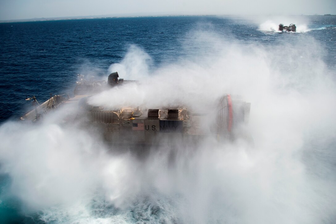 Navy hovercraft with Assault Craft Unit 5 depart USS Makin Island carrying 11th Marine Expeditionary Unit vehicles and personnel here May 1. The units are deployed as part of the Makin Island Amphibious Ready Group, currently a U.S. Central Command theater reserve force. The group is providing support for maritime security operations and theater security cooperation efforts in the U.S. Navy's 5th Fleet area of responsibility.