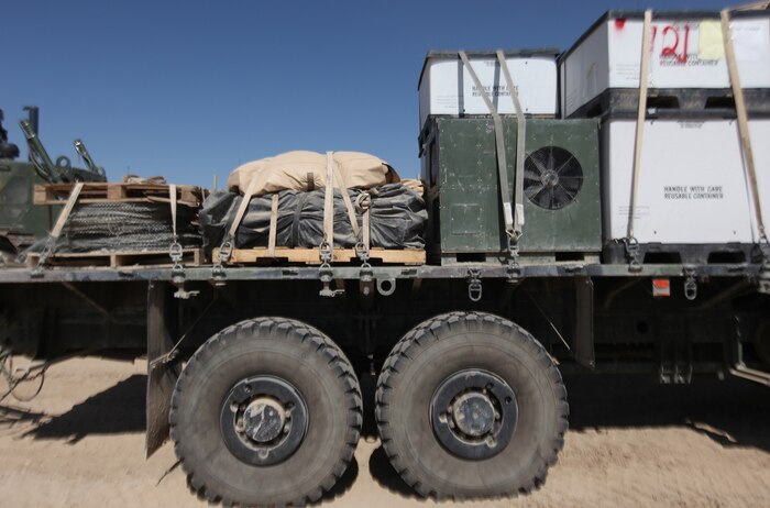 A myriad of supplies await transport by elements of Combat Logistics Battalion 6, 2nd Marine Logistics Group (Forward) aboard Forward Operating Base Nolay, Afghanistan Oct. 16, 2011. The battalion was acknowledged recently by the Defense Logistics Agency for requisitioning $1.8 million in gear during Fiscal Year 2011. Requisitioning and redistributing repair parts was of heightened importance in theater in order to maintain and repair the myriad of tactical vehicles needed for combat logistics patrols. (U.S. Marine Corps photo by Sgt. Justin J. Shemanski)