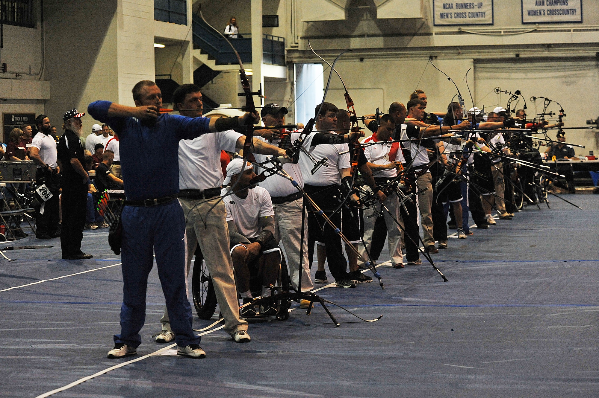 Kendall Madden and other athletes take part in the archery competition of Warrior Games 2012 at the U.S. Air Force Academy in Colorado Springs, Colo., May 2, 2012. Madden is with the Air Force team. (U.S. Air Force photo by Val Gempis) 