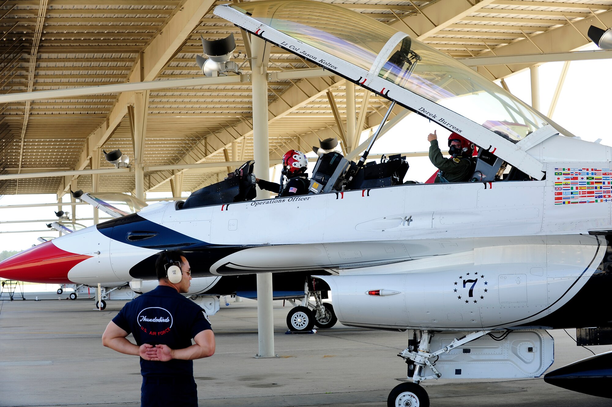 Derek Burress, host for the “Good Morning Sumter” broadcast, signals that he is ready for takeoff to U.S. Air Force Tech. Sgt. Sang Lee, U.S. Air Demonstration Squadron Thunderbirds aircrew flight equipment, at Shaw Air Force Base, S.C., May 2, 2012. The Thunderbirds are at Shaw for the Shaw Air Expo, which will be on May 5 and May 6. The Shaw Air Expo will have many Air Force and Army static displays. (U.S. Air Force photo by Airman 1st Class Hunter Brady/Released) 