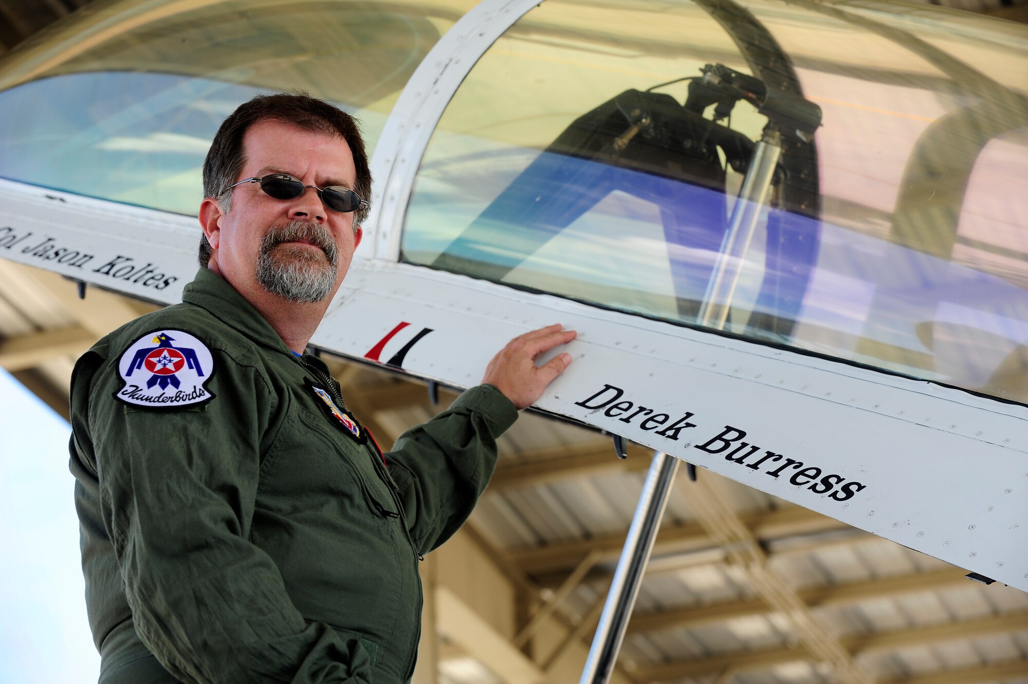 Derek Burress, host for the “Good Morning Sumter” broadcast, poses for a photo next to Thunderbird 7 at Shaw Air Force Base, S.C., May 2, 2012. The Thunderbirds are at Shaw for the Shaw Air Expo on May 5 and 6. The Shaw Air Expo will include performances from the U.S. Air Force Thunderbirds, U.S. Army Golden Knights and many other aircraft. (U.S. Air Force photo by Airman 1st Class Hunter Brady/Released) 