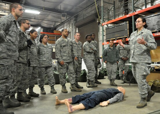 Tech. Sgt. Troyann Ernle, 627th Civil Engineer Squadron noncommissioned officer in charge of emergency management, briefs a group of Airmen during “Ability to Survive and Operate” training May 1, 2012, at Joint Base Lewis-McChord, Wash. “This training is much more hands-on and hopefully more impactful than taking an online training course,” said Ernle. (U.S. Air Force photo/Senior Airman Leah Young)