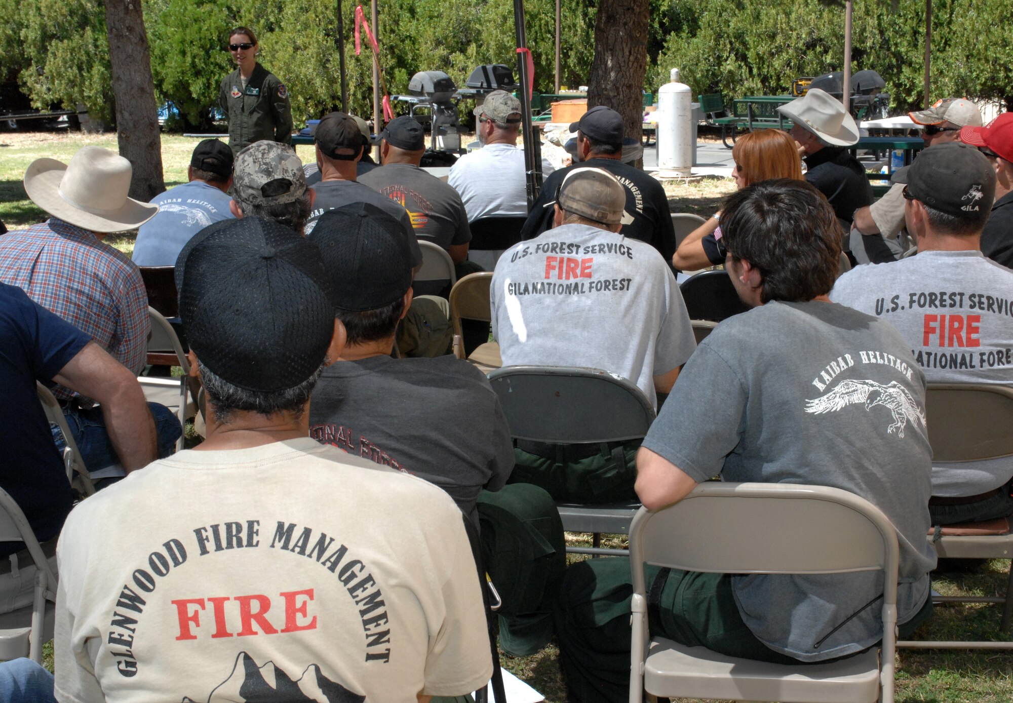 Members of the Arizona and New Mexico regional search and rescue community listen as U.S. Air Force Master Sgt. Lauren Hill, 563rd Operations Support Squadron flight engineer, speaks on the capabilities of the C-130 aircraft during an interagency meeting held at Grant Airport in Silver City, N.M. April 20, 2012. Speakers during the meeting also included an HH-60 Pavehawk pilot and a pararescueman. (U.S. Air Force photo by Airman 1st Class Saphfire Cook/Released)