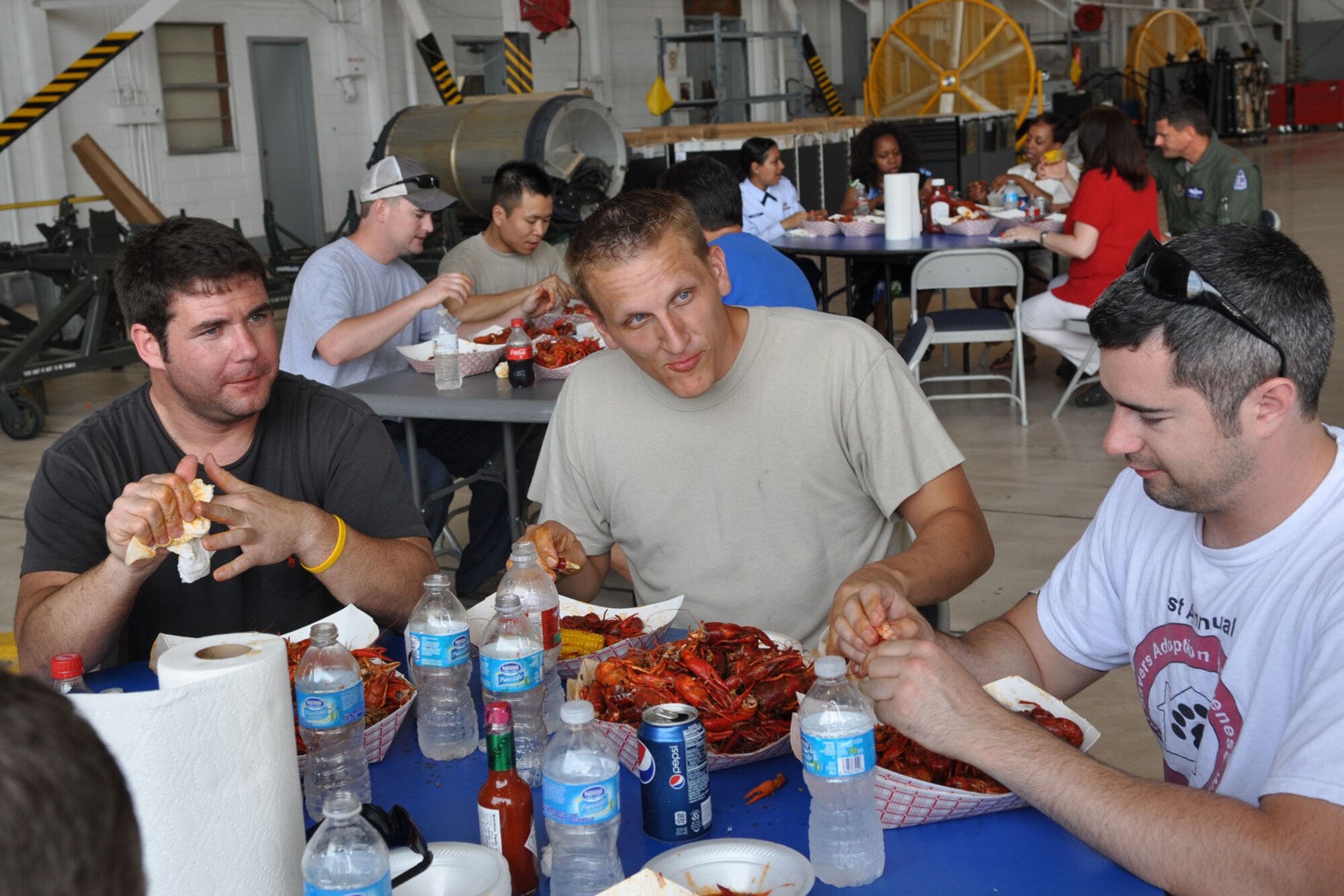 Airmen from the 307th Bomb Wing and 917th Fighter Group, crack, peel and nibble away, during a crawfish luncheon at Barksdale Air Force Base, La., April 30, 2012. The luncheon was sponsored by Mr. Boyd Parker and the Shreveport Rubber and Gasket Company in “appreciation for what Barksdale Air Force Base does for the freedom we enjoy.” The menu consisted of crawfish, corn on the cob, new potatoes, water and soda pop. (U.S. Air Force photo by Betty Stephens) 