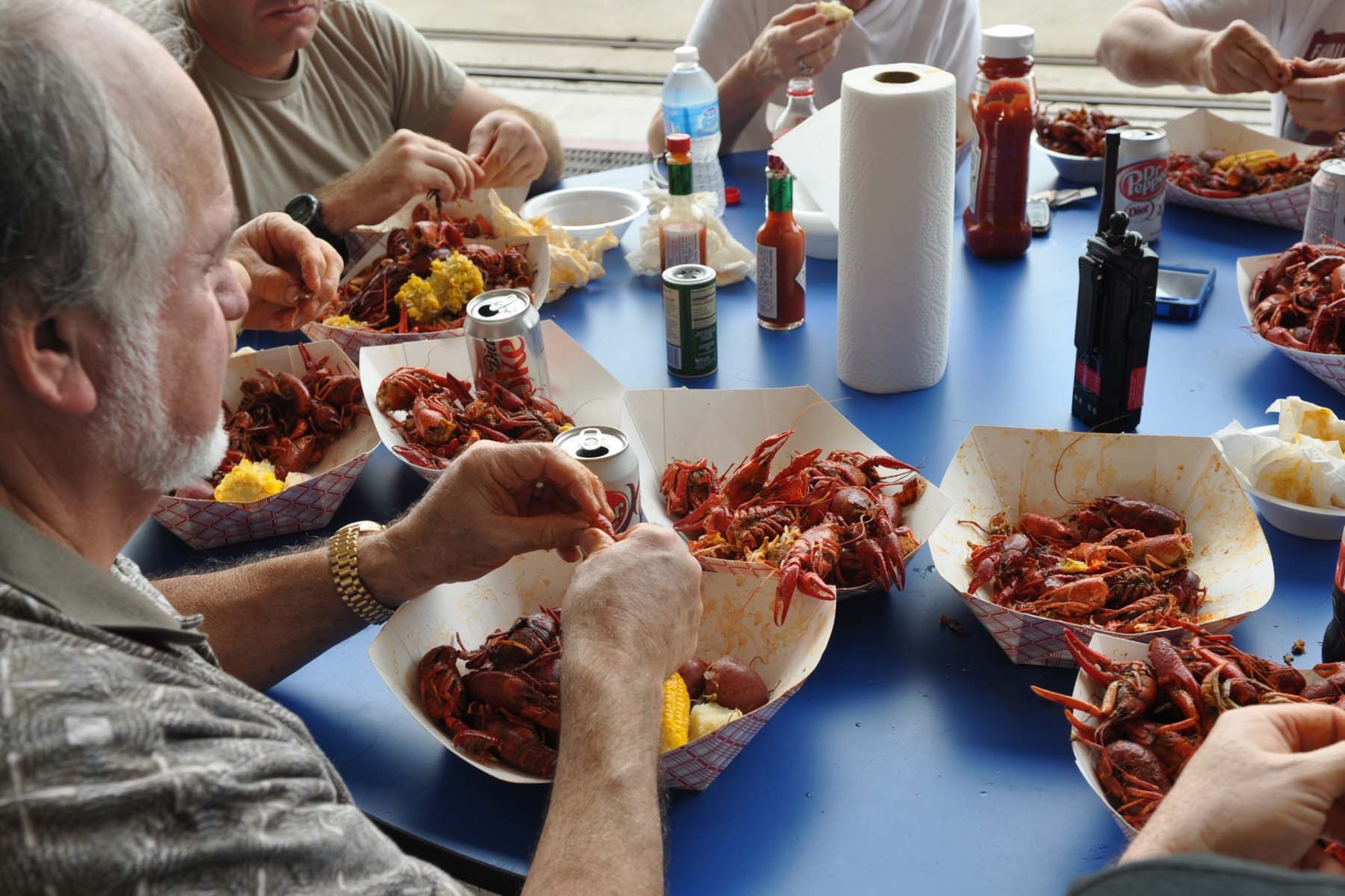 Lionel Robin, hospitality chef for Tabasco, enjoys a Louisiana delicacy during a crawfish luncheon at Barksdale Air Force Base, La., April 30, 2012. The luncheon was sponsored by Mr. Boyd Parker and the Shreveport Rubber and Gasket Company in “appreciation for what Barksdale Air Force Base does for the freedom we enjoy.” The menu consisted of crawfish, corn on the cob, new potatoes, water and soda pop. (U.S. Air Force photo by Betty Stephens) 