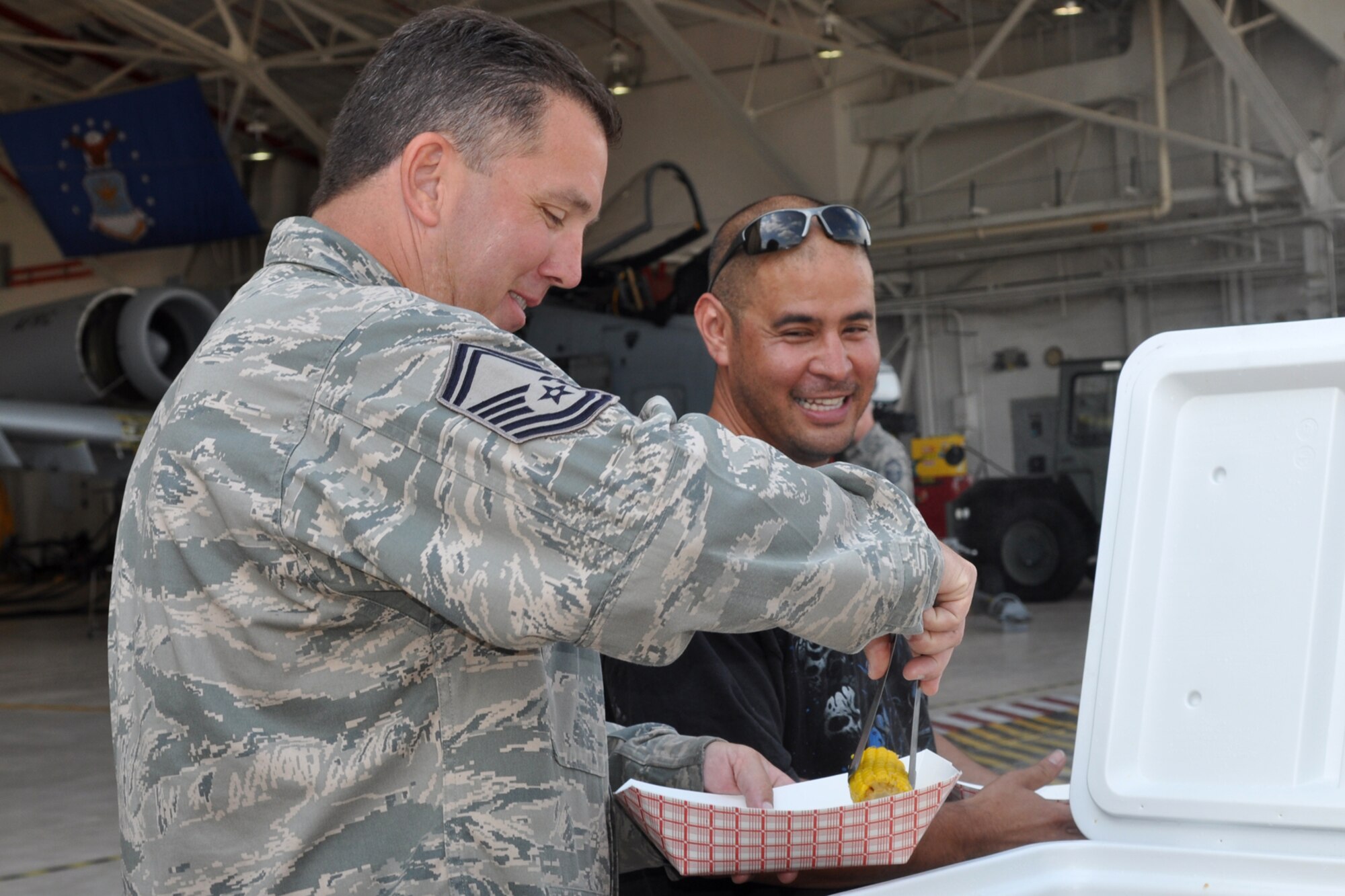 Senior Master Sgt. Jeffery Schilling, who is the accessory flight chief for the 917th Maintenance Squadron, picks the perfect corn on the cob during a luncheon in the A-10 Hangar at Barksdale Air Force Base, La., April 30, 2012. The luncheon, which was held for Airmen from the 307th Bomb Wing and 917th Fighter Group, was sponsored by Mr. Boyd Parker and Shreveport Rubber and Gasket Company in “appreciation for what Barksdale Air Force Base does for the freedom we enjoy.” (U.S. Air Force photo by Betty Stephens) 