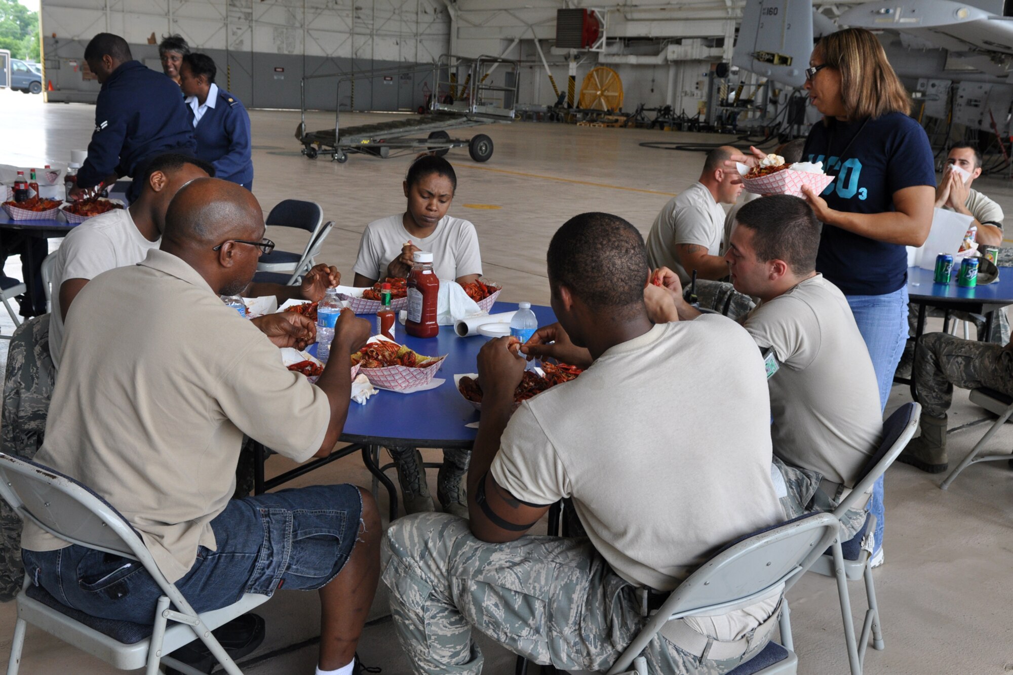 Airmen from the 307th Bomb Wing and 917th Fighter Group, crack, peel and nibble away, during a crawfish luncheon at Barksdale Air Force Base, La., April 30, 2012. The luncheon was sponsored by Mr. Boyd Parker and the Shreveport Rubber and Gasket Company in “appreciation for what Barksdale Air Force Base does for the freedom we enjoy.” The menu consisted of crawfish, corn on the cob, new potatoes, water and soda pop. (U.S. Air Force photo by Master Sgt. Jeff Walston) 