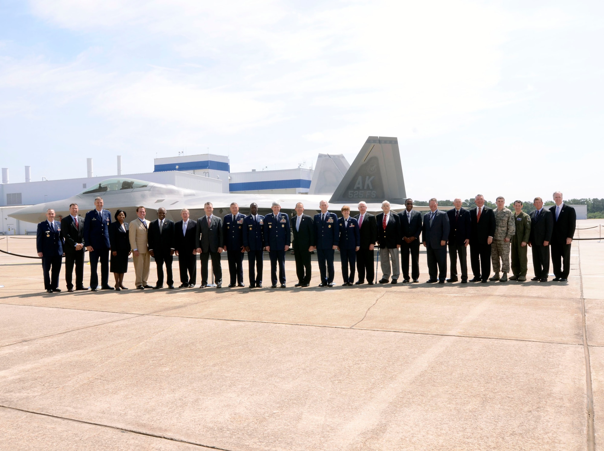 Air Force senior leaders and Lockheed Martin Aeronautical Company executives attend the formal ceremony unveiling the last F-22 Raptor at the Marietta, Ga. plant May 2. (U.S. Air Force photo/Don Peek)