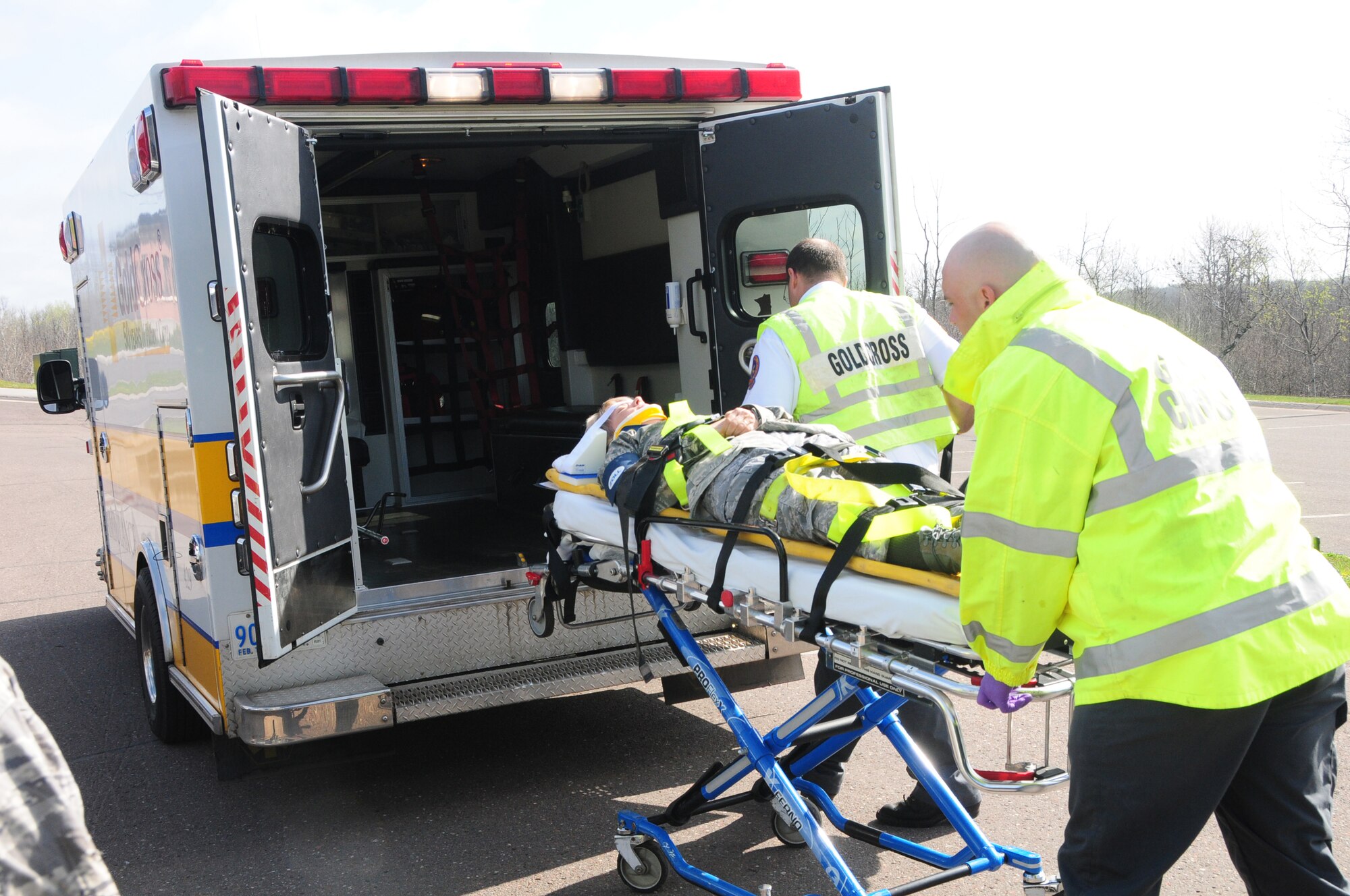 A 148th Fighter Wing member with simulated injuries is loaded into an ambulance by EMS responders from Gold Cross.  Both the 148th Fighter Wing and local emergency responders were participating in an emergency response training exercise on May 2, 2012 at the 148th Fighter Wing, Duluth, Minn. ( National Guard photo by Master Sgt. Ralph J. Kapustka)