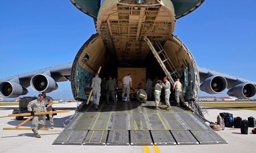 Members from the 42nd Aerial Port, 337th Flying, and 439th Maintenance Squadron load the Westover C-5B Galaxy at Patrick Air Force Base, Cocoa Beach, Florida on May 1, 2012. Westover Tactical Airlift Control Flight reservists, as well as those from March ARB and Dover AFB, trained with two FBI Rapid Deployment Teams from the NY & D.C area April 26 - 29th at the base. (U.S. Air Force photo/SrA. Kelly Galloway)