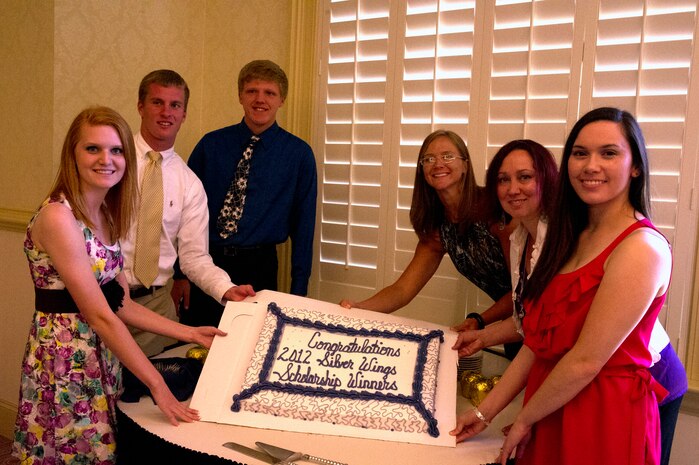 At a ceremony held May 2, the Team Charleston Spouses Club presented scholarships to six deserving individuals. (Left to right) Elizabeth Wham, daughter of Col. Benjamin Wham;  Austin Pendergist, son of retired Lt. Cmdr. Dennis Pendergist;  Alex McMeekin, son of Senior Master Sgt. Michelle McMeekin;  Courtney Reeves, wife of Jonathan Reeves;  Shanna May, wife of Tech. Sgt. Gregory May and Kathleen Domingo, spouse of Senior Airman John Domingo. (U.S. Air Force photo/ Airman 1st Class Chacarra Walker)