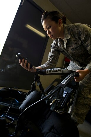 Senior Airman Leah Erlandson checks air levels on a MSA Firehawk self-contained breathing apparatus during a demonstration at Joint Base Charleston - Air Base April 16. Bioenvironmental Engineering technicians perform health risk assessments for everyone on base to keep them safe from whatever exposures their job may present. Erlandson is a 628th Aerospace Medicine Squadron Bioenvironmental Engineering technician. (U.S. Air Force photo/Airman 1st Class George Goslin)