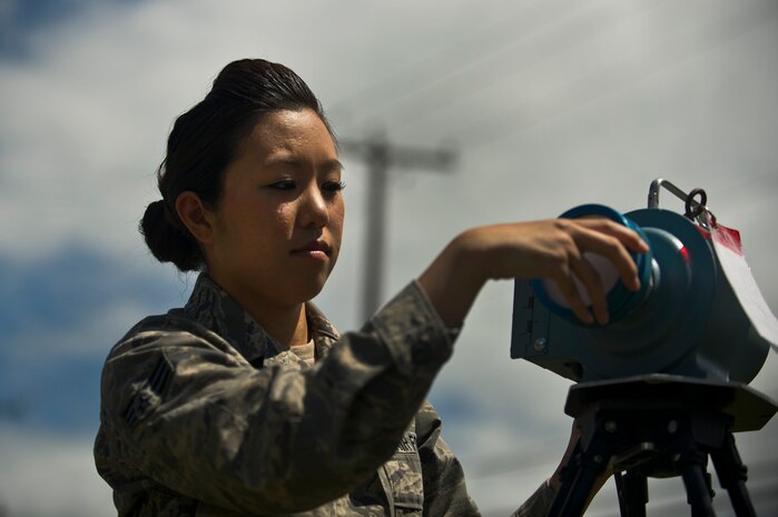 Senior Airman Leah Erlandson sets up a Radeco radiation air sampler during a demonstration at Joint Base Charleston - Air Base  April 16. Bioenvironmental Engineering technicians perform health risk assessments for everyone on base to keep them safe from whatever exposures their job may present. Erlandson is a 628th Aerospace Medicine Squadron Bioenvironmental Engineering technician. (U.S. Air Force photo/Airman 1st Class George Goslin)