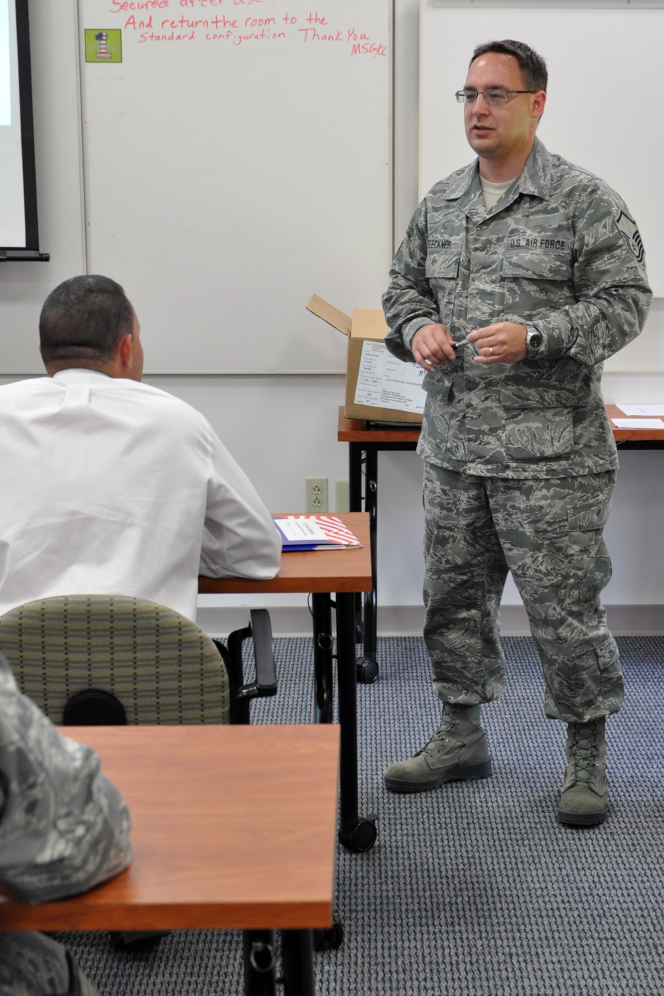 YOUNGSTOWN AIR RESERVE STATION, Ohio — Master Sgt. Rob Breeckner, NCOIC of Newcomers Orientation with the 910th Force Support Squadron, talks to the incoming Service members here last year about the schedule for the day. Newcomers Orientation includes briefings from representatives in multiple offices at YARS. U.S. Air Force Reserve photo by Staff Sgt. Valerie Smock.
