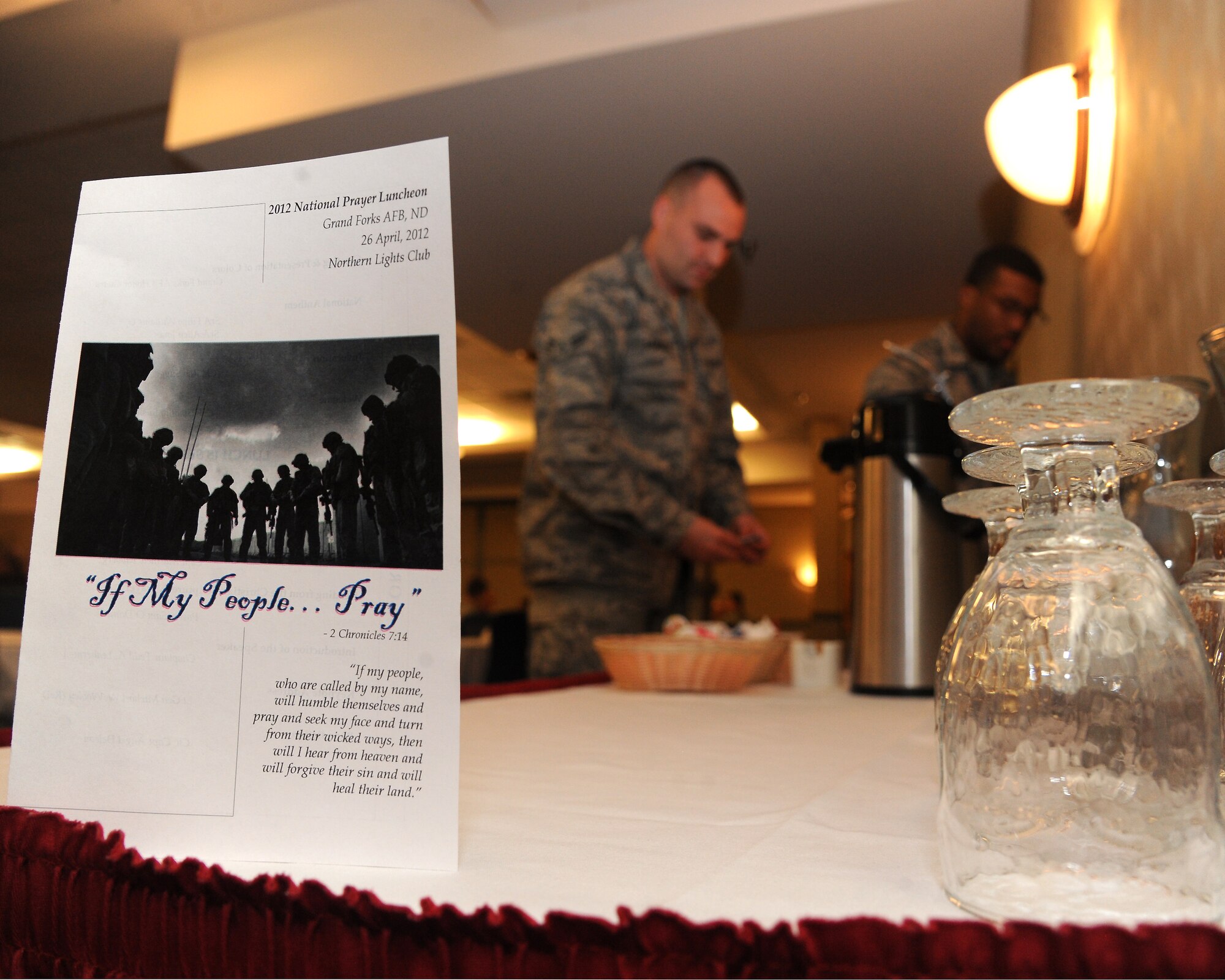 Air Force members grab refreshments at the National Prayer Luncheon on April 26, 2012, on Grand Forks Air Force Base, N.D.  (U.S. Air Force photo by Airman 1st Class Navarro)