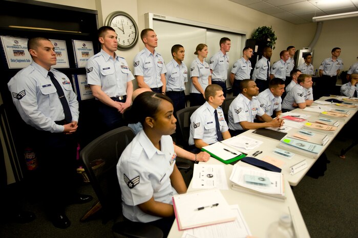 Students attending Airman Leadership School listen as the Fallen Defenders Legacy Project is presented to Defender Flight, May 2, 2012, at Nellis Air Force Base, Nev. The Fallen Defenders Legacy Project is a memorial to the nine security forces Airmen killed in action since the War on Terror. (U.S. Air Force photo by Staff Sgt. William P.Coleman)