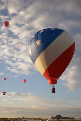 Maj. Kenneth Weiner, 18th Air Force, pilots his hot air ballon over Indianapolis recently. Weiner also flys his balloon in the local area. ( Courtesy photo)