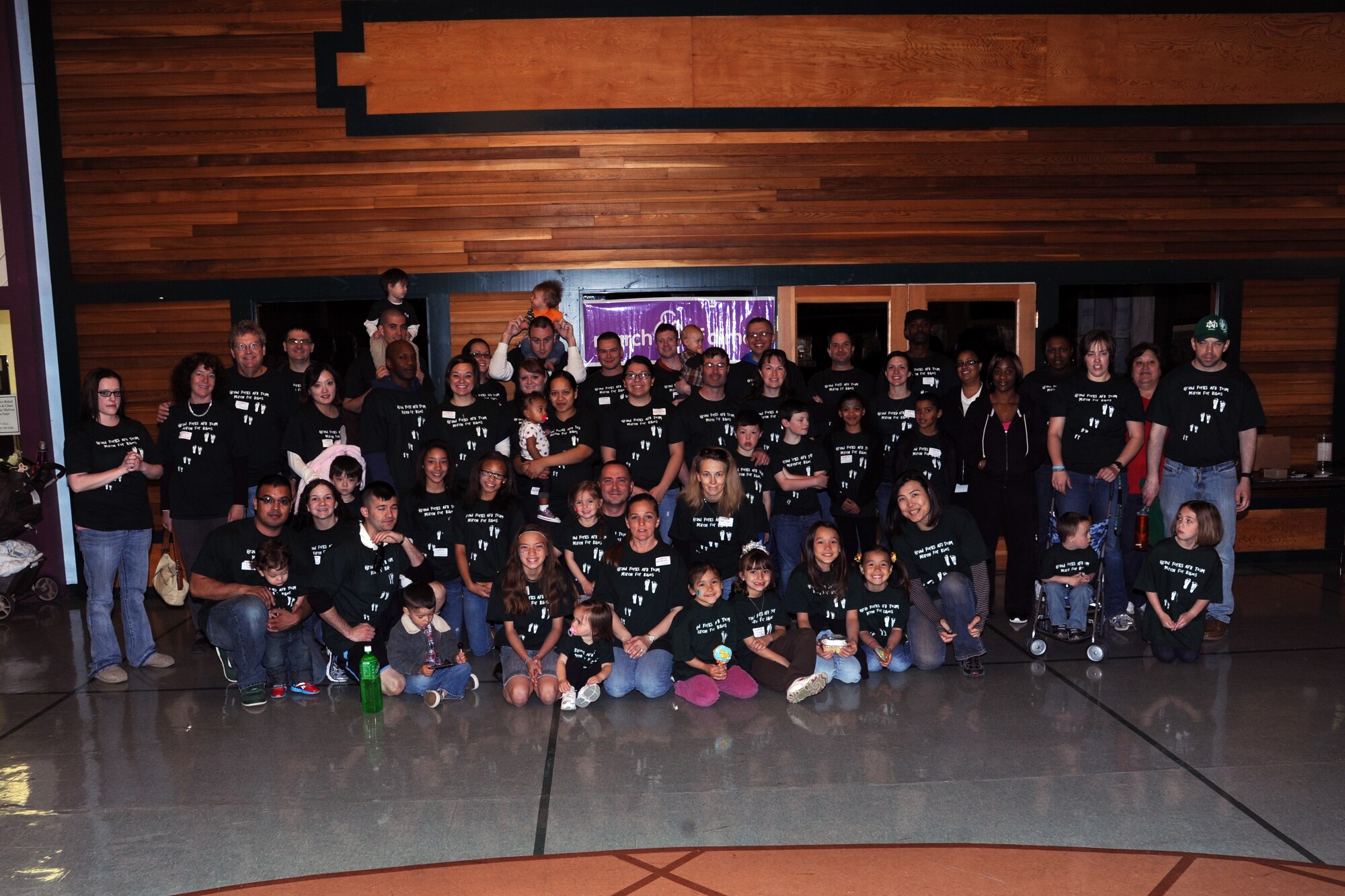 Nearly 60 members of the Grand Forks Air Force Base “March for Babies” team pose for a picture after the fundraiser at the Grand Cities Mall in downtown Grand Forks, N.D., on April 28, 2012. (U.S. Air Force photo/Tim Flack)