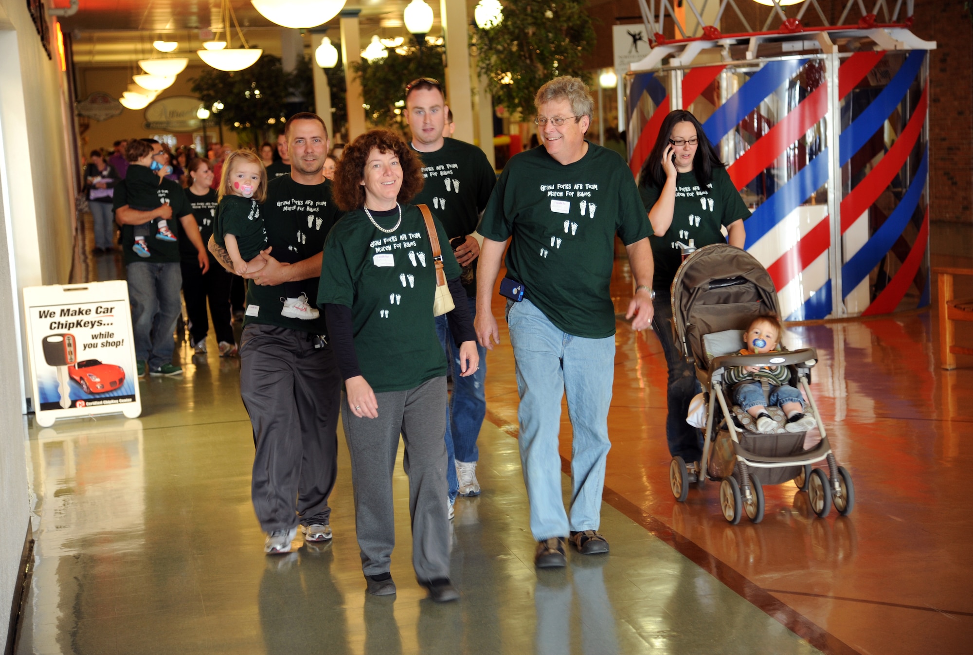 Members of the Grand Forks Air Force Base “March for Babies” team walk through the Grand Cities Mall in downtown Grand Forks, N.D., on April 28, 2012. (U.S. Air Force photo/Tim Flack)