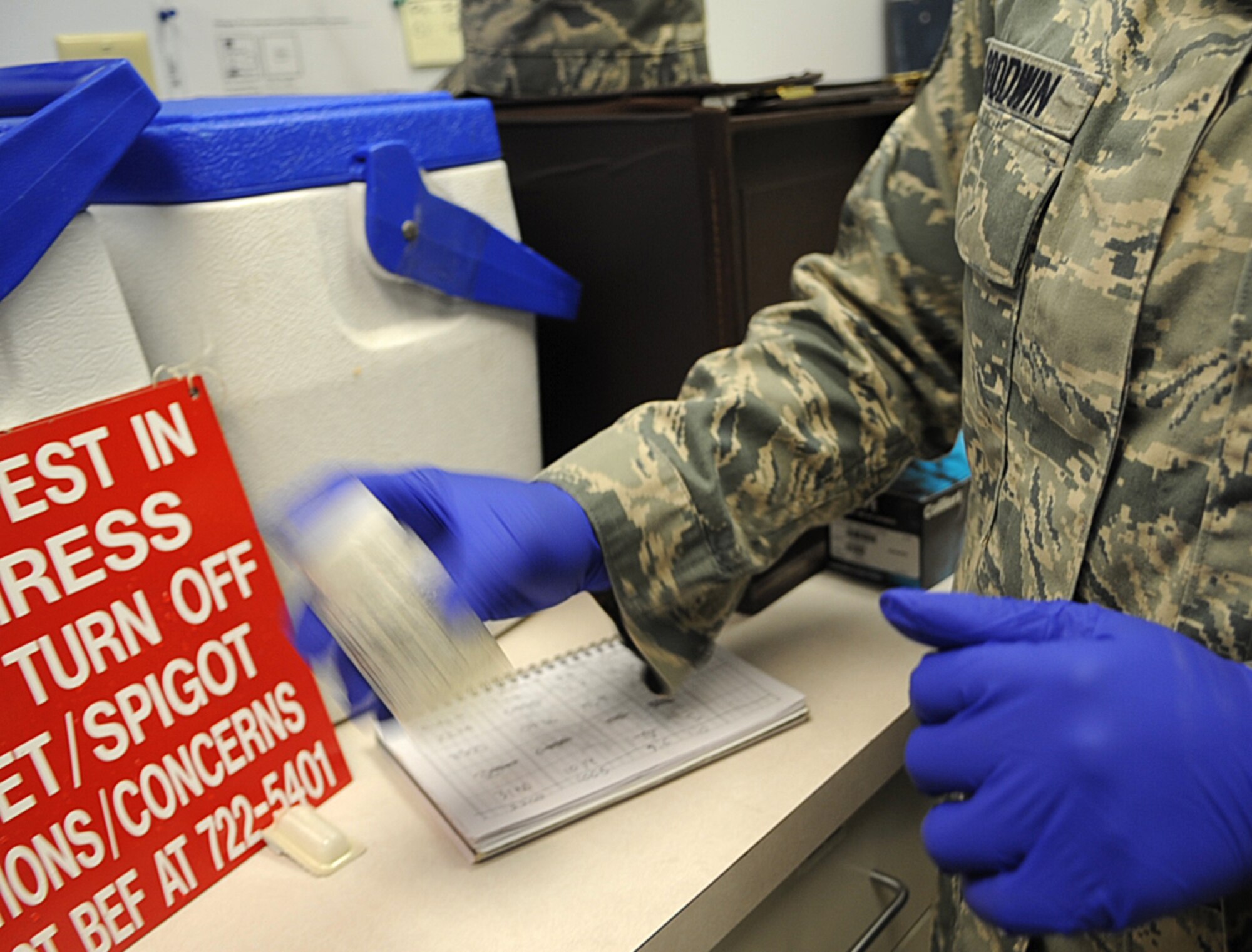 U.S. Air Force Staff Sgt. Sherring Goodwin shakes a water sample while testing for bacteria on Seymour Johnson Air Force Base, N.C., May 1, 2012. When conducting in-house water testing for bacteria, Goodwin mixes the sample with colilert reagent powder prior to placing it into an incubator for further observation. Colilert reagent powder is used around the world for the detection of coliforms and E. coli in water. Goodwin, 4th Aerospace Medicine Squadron environmental surveillance non-commissioned officer in charge, hails from Crossett, Ark. (U.S. Air Force photo/Airman 1st Class Aubrey Robinson/Released)