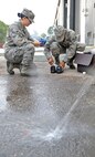 U.S. Air Force Airmen 1st Class Andrea Spanjer and Oshane Wint test the chlorine and pH levels in water samples collected on Seymour Johnson Air Force Base, N.C., May 1, 2012. Bioenvironmental apprentices require at least 14 on-the-job training hours before they are allowed to conduct bacteria testing on their own. Spanjer, 4th Aerospace Medicine Squadron bioenvironmental apprentice, hails from Seattle. Wint, 4th AMDS bioenvironmental engineer apprentice, hails from Englewood, N.J. (U.S. Air Force photo/Airman 1st Class Aubrey Robinson/Released)