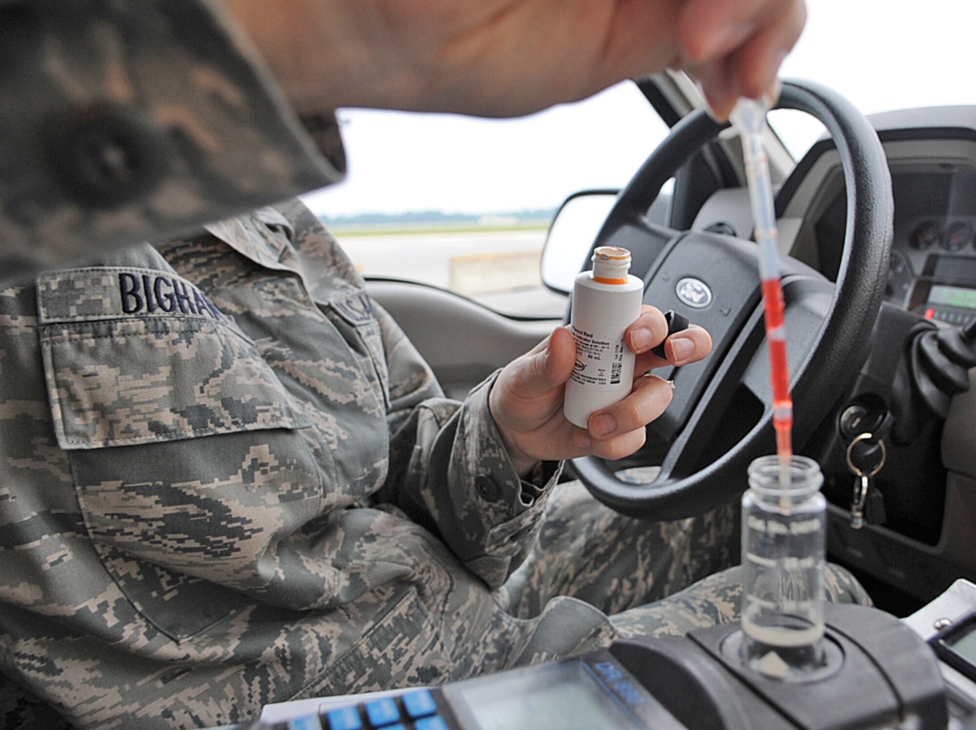 U.S. Air Force Senior Airman Kataryna Bigham tests the chlorine and pH levels in a water sample on Seymour Johnson Air Force Base, N.C., May 1, 2012. Water and fuels systems maintainers from the 4th Civil Engineer Squadron collect water samples from several locations around base daily to ensure it is safe for consumption. Bigham, 4th CES water and fuels systems maintenance journeyman, hails from Maybee, Mich. (U.S. Air Force photo/Airman 1st Class Aubrey Robinson/Released)