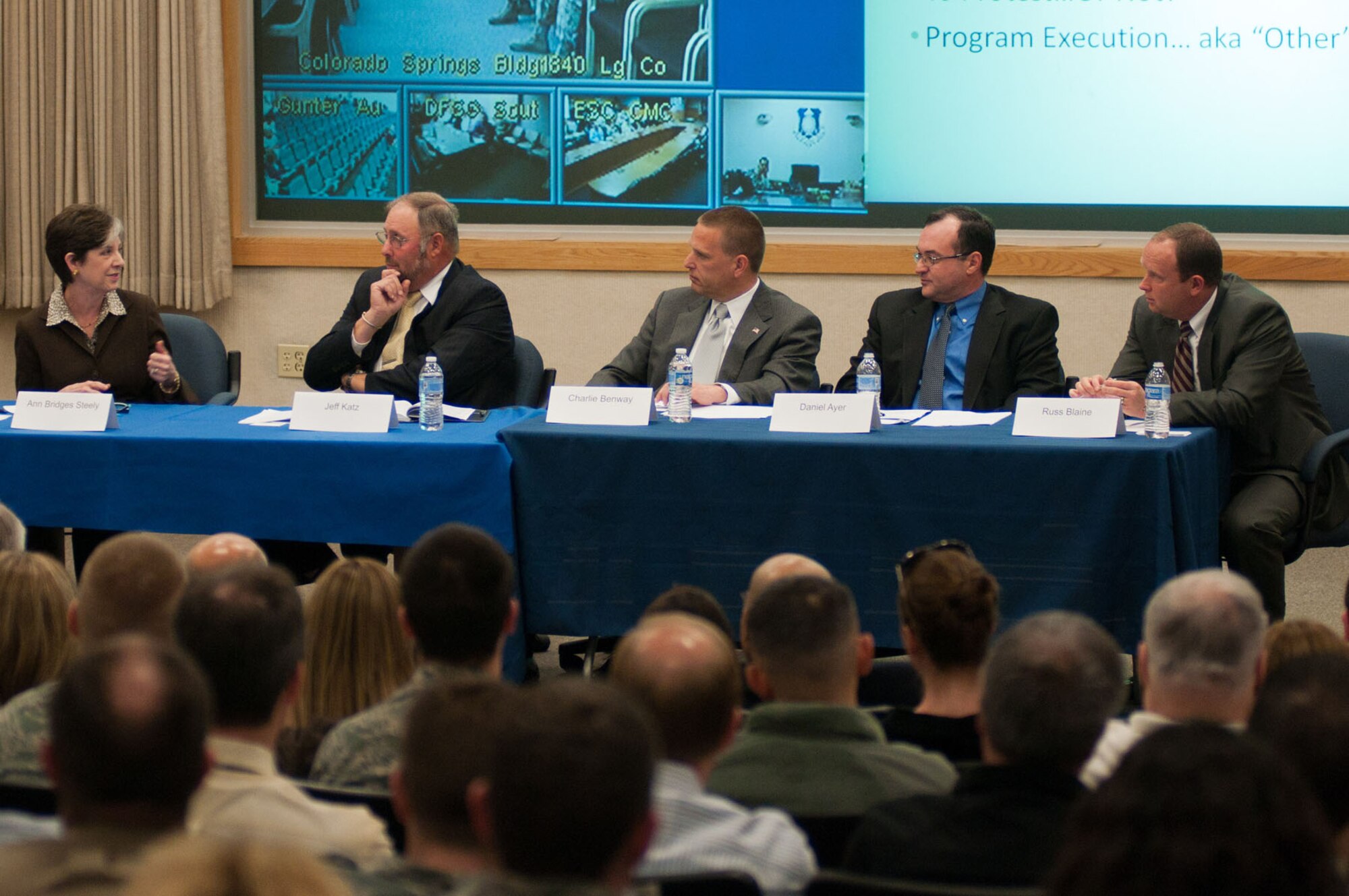 HANSCOM AIR FORCE BASE, Mass. - Ann Bridges Steely addresses a question during the Hanscom Representatives Association Acquisition Panel at the Hanscom Conference Center April 26. Steely and panelists, from left to right, Jeff Katz, Charlie Benway and Dan Ayer, along with moderator Russ Blaine, presented challenges and concerns from the defense industry perspective to the audience of Electronic Systems Center acquisition personnel. ESC's geographically separated units were also able to participate via video teleconference. (U.S. Air Force photo by Rick Berry)