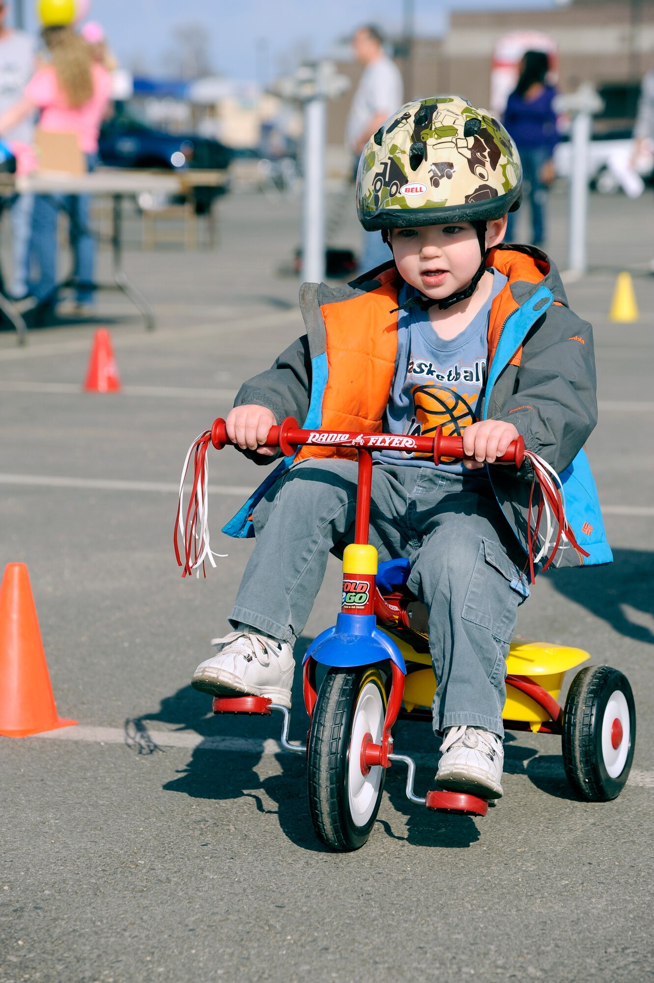 Samuel Stamm, 3-year-old son of Staff Sgt. Aaron Stamm, 354th Maintenance Squadron assistant avionics flight chief, bikes through a safety course during the 2nd Annual Children’s Safety Day April 30, 2012, Eielson Air Force Base, Alaska. The course informed children on what steps to take while biking when cars approach.  (U.S. Air Force photo/Staff Sgt. Jim Araos)