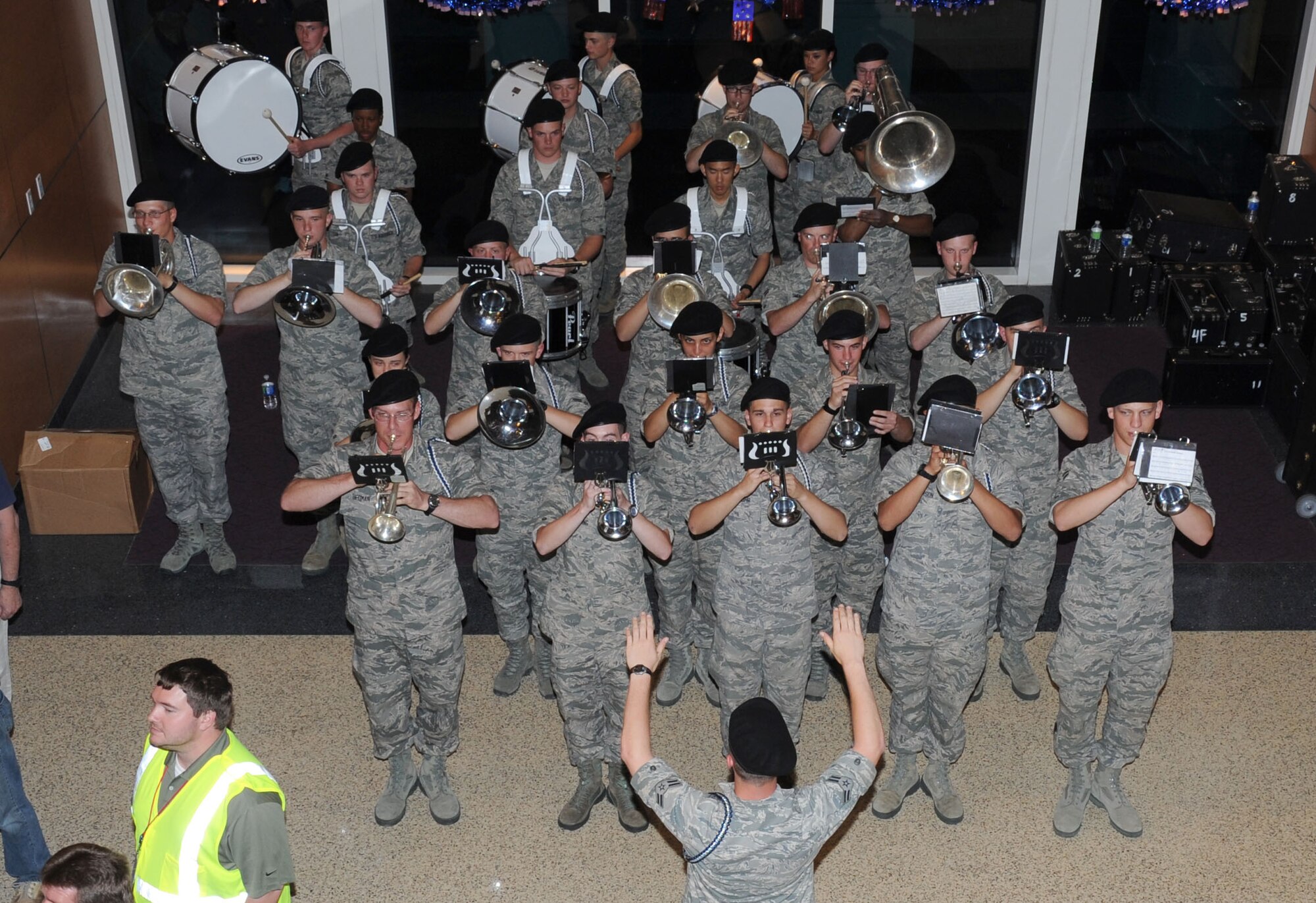 The Keesler Air Force Base Drum and Bugle Corps performs during the return of World War II veterans from the third Mississippi Gulf Coast Honor Flight to Washington, D.C.,  April 24, 2012, at the Gulfport/Biloxi International Airport. The Honor Flight program receives donations to honor our nation’s World War II veterans by sending them on a one-day visit to Arlington National Cemetery in Washington, D.C.  (U.S. Air Force photo by Kemberly Groue)