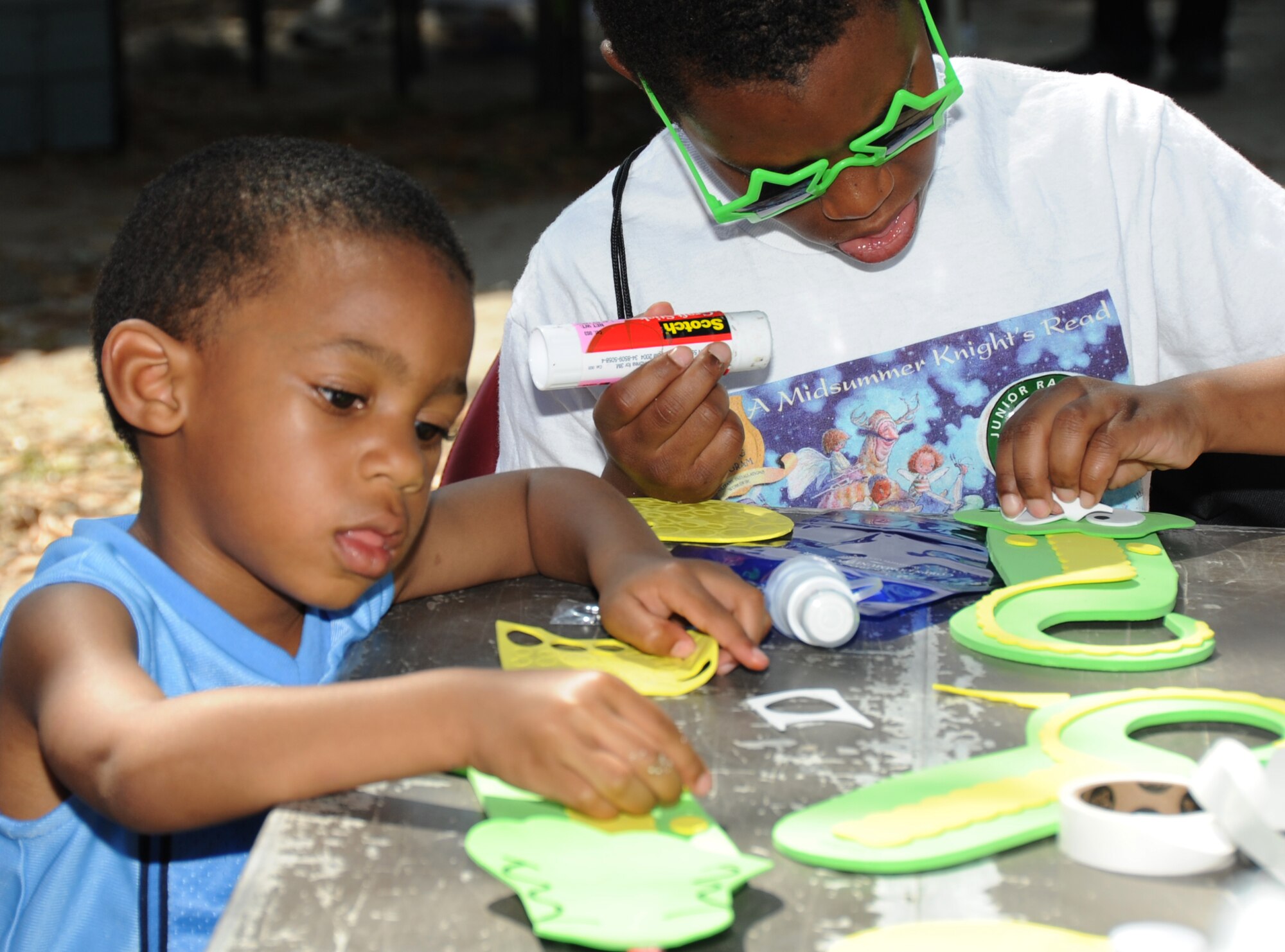 Donovan, 3, and his brother Rasheed Wells, 7, assemble a foam alligator during Child Pride Day April 28, 2012, at Marina Park, Keesler Air Force Base, Miss.  Donovan and Rasheed’s parents are January Tillman-Wells and 2nd Lt. Derrick Wells, 81st Medical Operations Squadron.  Child Pride Day is an annual event held in conjunction with the month of the military child.  Booths, jumpers, activities, entertainment and food were set up throughout the park.  (U.S. Air Force photo by Kemberly Groue)