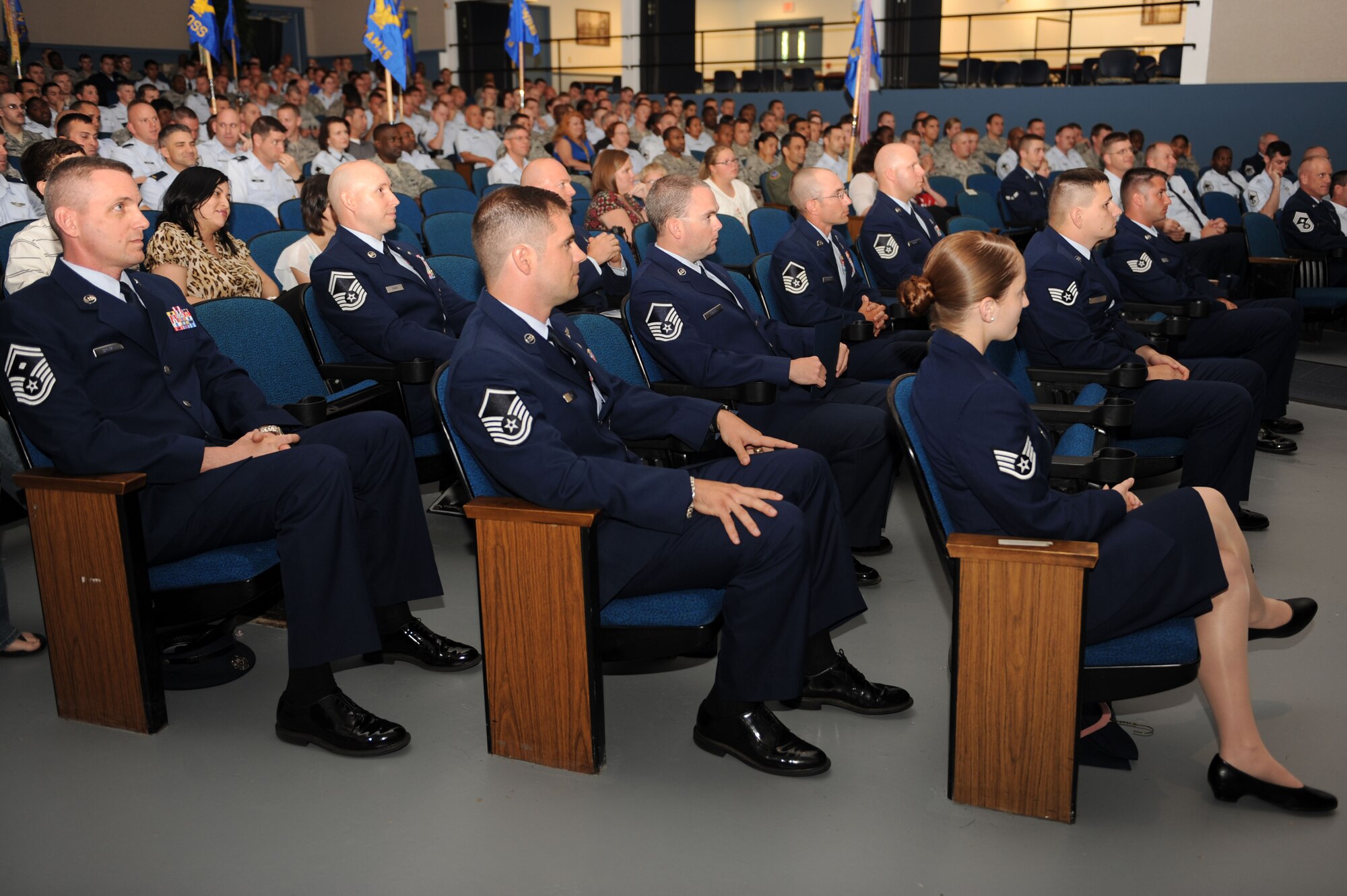 Recently promoted Airmen listen to closing remarks at a non-commissioned officer promotion ceremony at Moody Air Force Base, Ga., April 30, 2012. Moody hosts a ceremony each month to recognize the promotees. (U.S. Air Force photo by Staff Sgt. Ciara Wymbs/Released) 