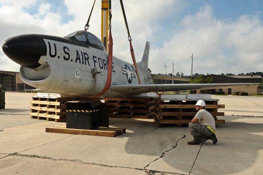 U.S. Air Force Tech. Sgt. Anthony Restivo, 23d Equipment Maintenance Squadron, inspects the placement of an F-86L Sabre at Moody Air Force Base, Ga., May 1, 2012. The F-86L was dedicated in honor of Maj. Lyn Macintosh, a Valdosta native rescue pilot killed April 25, 1980, in Operation Iron Claw -- a rescue attempt for Americans held hostage in Tehran, Iran. (U.S. Air Force photo by Staff Sgt. Ciara Wymbs/Released)