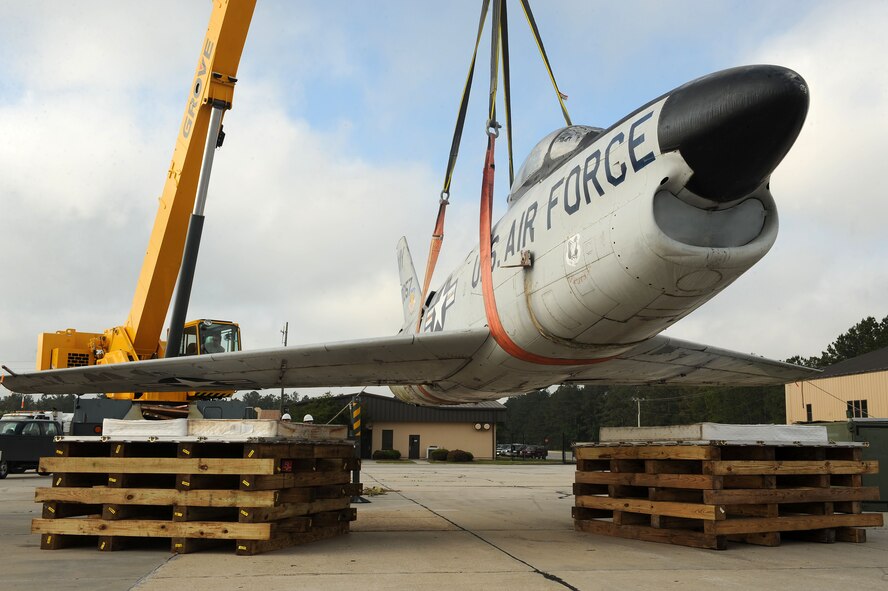 A crane hoists an F-86L Sabre at Moody Air Force Base, Ga., May 1, 2012. The F-86L was recently relocated from the corner of Ashley Street and Woodrow Wilson Drive near downtown Valdosta to be added to Moody’s air park. (U.S. Air Force photo by Staff Sgt. Ciara Wymbs/Released) 