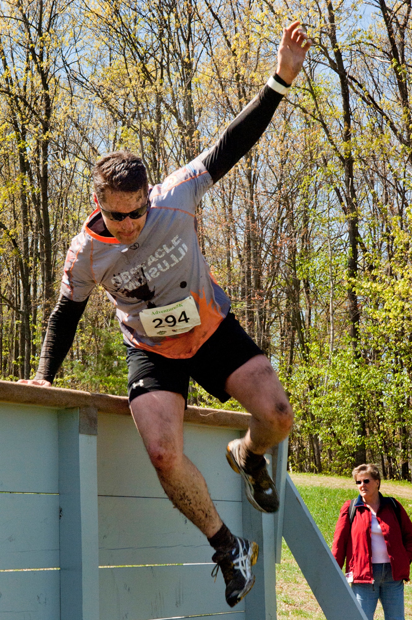 MANCHESTER, N.H. -- Senior Airman Luke Gregory navigates an obstacle during the Adventure 5k at McIntyre Ski area April 28. Gregory and ten others from the New Hampshire Air National Guard participated as a team called Obstacle Illusion. More than 800 participants ran through mud trails and over obstacles during the 3.1 mile event. (National Guard photo by Tech. Sgt. Mark Wyatt/Released)