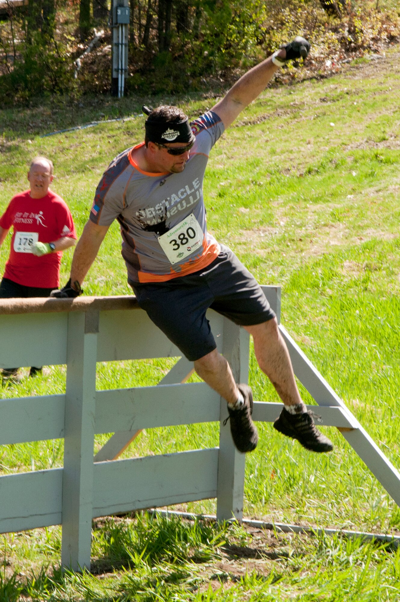 MANCHESTER, N.H. -- Tech. Sgt. Mike Keegan hurdles an obstacle at the Adventure 5k at McIntyre Ski area April 28. Keegan and ten others from the New Hampshire Air National Guard participated as a team called Obstacle Illusion. (National Guard photo by Tech. Sgt. Mark Wyatt/Released)