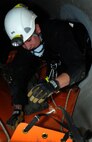 Kevin Smith, Schriever Fire Department firefighter, secures a “victim” for transport during confined-space training May 1 at Schriever Air Force Base. Staying proficient at confined space entries, rescues and recoveries is a federal and Air Force requirement. (U.S. Air Force photo/Staff Sgt. Julius Delos Reyes)