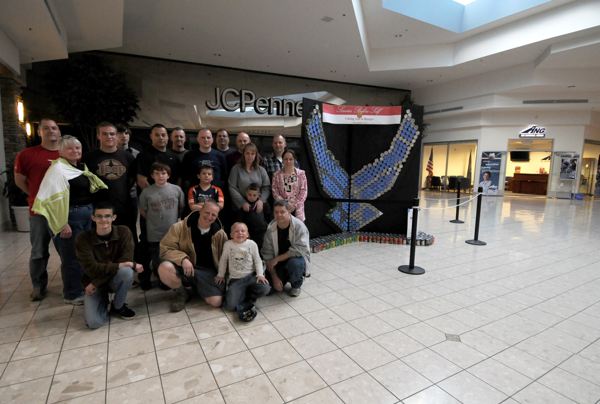 Servicemembers from the 110th Airlift Wing, Battle Creek Air National Guard Base and their families participate in the local food drive Canned Sculpture Exhibit held at Lakeview Square Mall, Battle Creek, Mich., on Sunday, April 22, 2012. A donation of over $600 was collected toward the sculpture equaling over a 1,000 cans. All food collected is donated to the Food Bank of South Central Michigan. Sculptures will be on display until Sunday, May 6, 2012. (U.S. Air National Guard Photo by Master Sgt. Sonia Pawloski/Released)