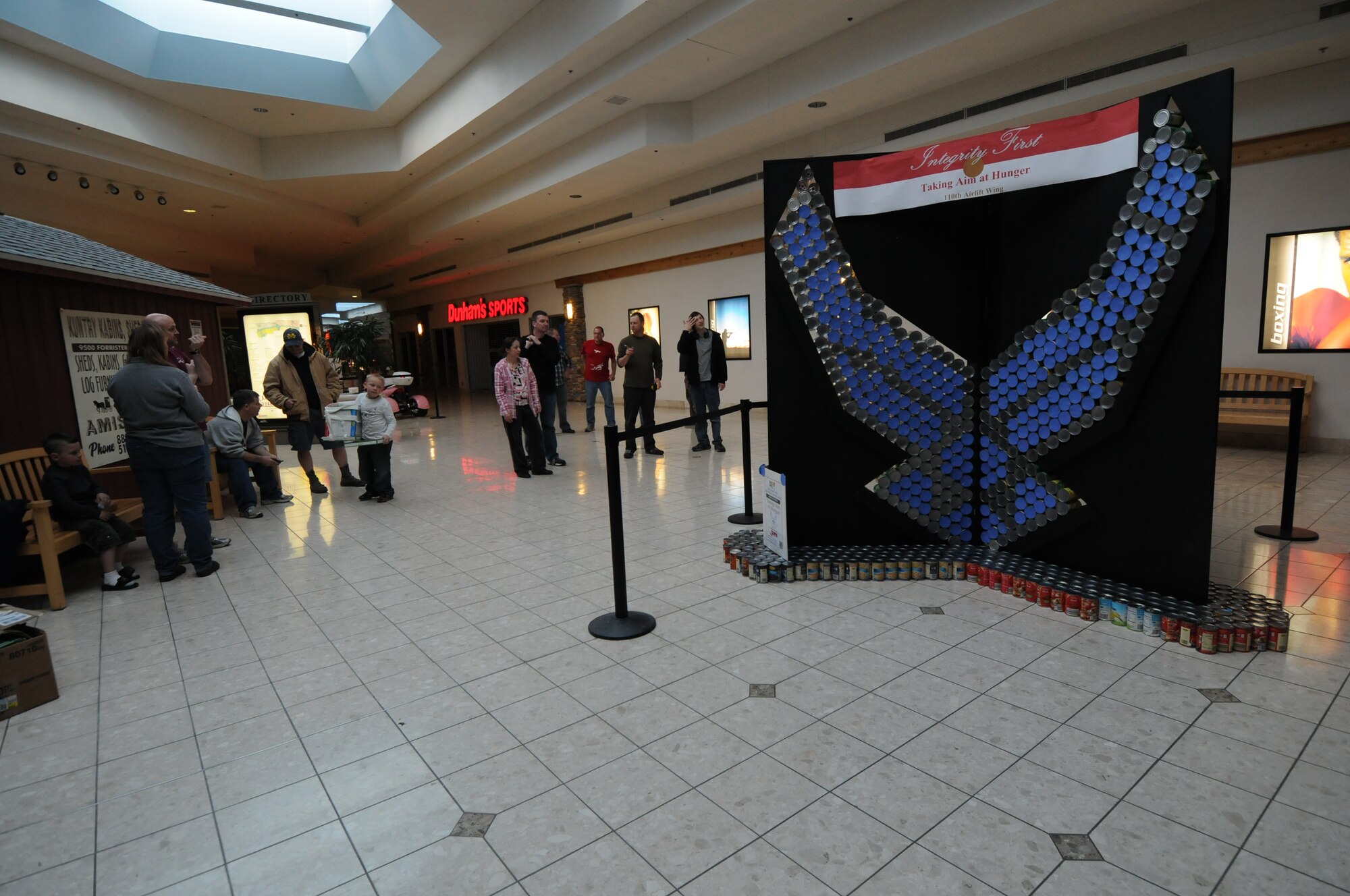 Servicemembers from the 110th Airlift Wing, Battle Creek Air National Guard Base and their families participate in the local food drive Canned Sculpture Exhibit held at Lakeview Square Mall, Battle Creek, Mich., on Sunday, April 22, 2012. A donation of over $600 was collected toward the sculpture equaling over a 1,000 cans. All food collected is donated to the Food Bank of South Central Michigan. Sculptures will be on display until Sunday, May 6, 2012. (U.S. Air National Guard Photo by Master Sgt. Sonia Pawloski/Released)