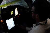 Richard “Tuff” Hedeman, a three-time World Champion bull rider, takes flight in a T-38C Talon simulator at the 47th Flying Training Wing Operations building at Laughlin Air Force Base, Texas, April 27, 2012. The tour offered the six professional bull riders a firsthand look at the 47th FTW’s mission of training world class pilots, deploying mission-ready Airmen and developing professional, disciplined leaders. (U.S. Air Force photo/Airman 1st Class Nathan Maysonet) 