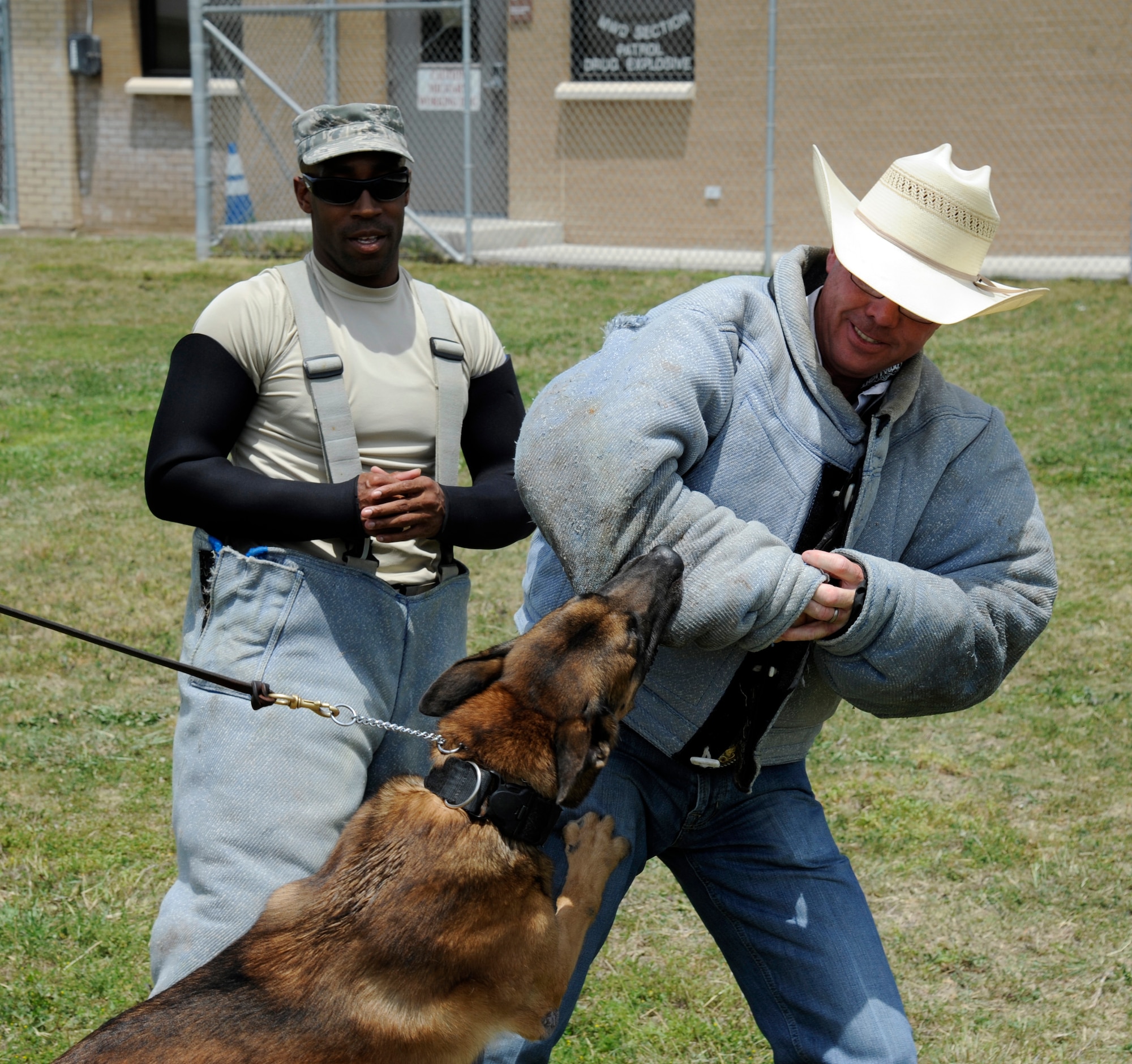 Richard “Tuff” Hedeman, a three-time World Champion bull rider, takes on a military working dog from the 47th Security Forces Squadron dog kennel during a tour of Laughlin Air Force Base, Texas, April 27, 2012. The tour offered the six professional bull riders a firsthand look at the 47th Flying Training Wing’s mission of training world class pilots, deploying mission-ready Airmen and developing professional, disciplined leaders. (U.S. Air Force photo/Airman 1st Class Nathan Maysonet) 