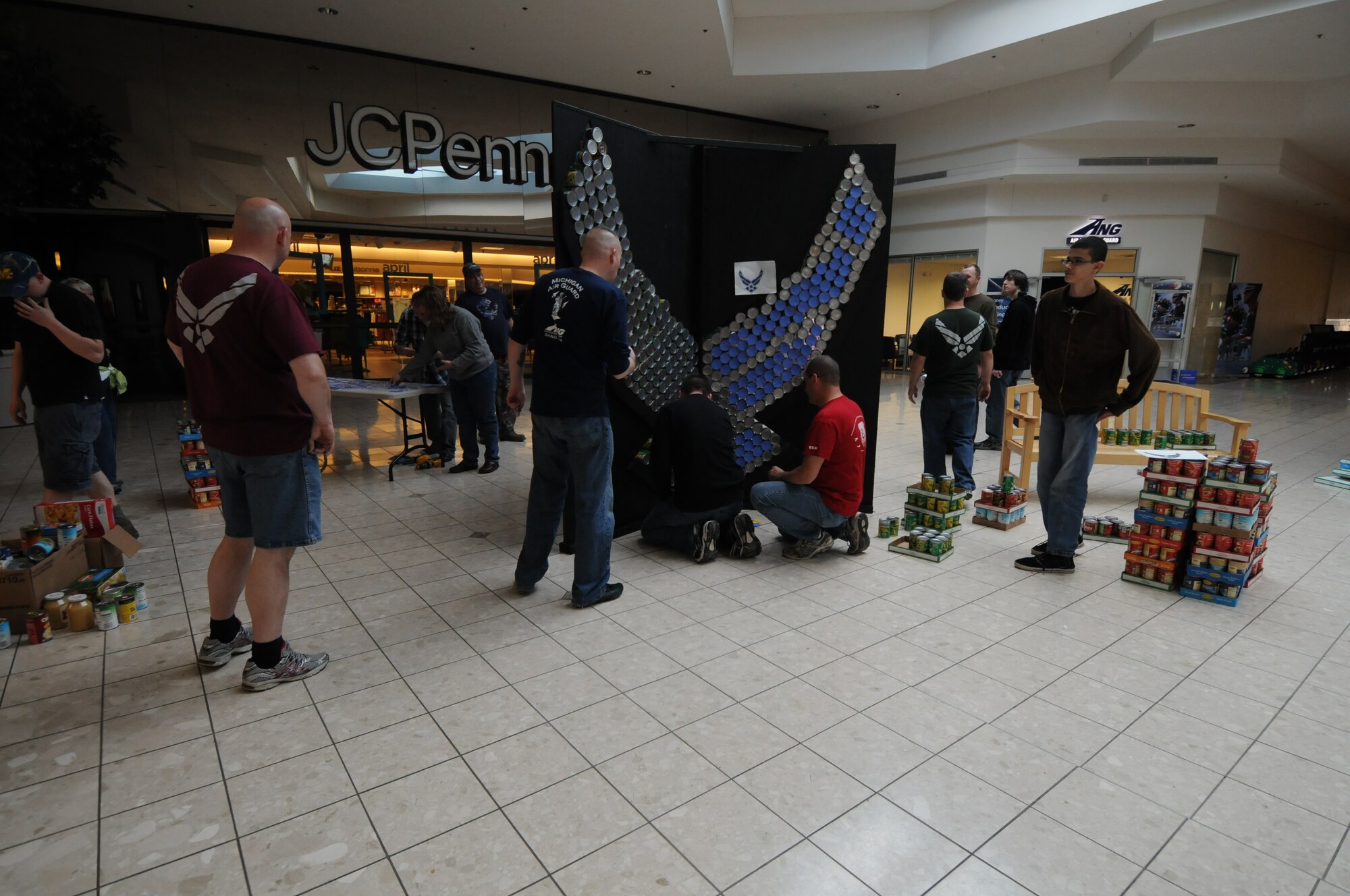 Servicemembers from the 110th Airlift Wing, Battle Creek Air National Guard Base and their families participate in the local food drive Canned Sculpture Exhibit held at Lakeview Square Mall, Battle Creek, Mich., on Sunday, April 22, 2012. A donation of over $600 was collected toward the sculpture equaling over a 1,000 cans. All food collected is donated to the Food Bank of South Central Michigan. Sculptures will be on display until Sunday, May 6, 2012. (U.S. Air National Guard Photo by Master Sgt. Sonia Pawloski/Released)