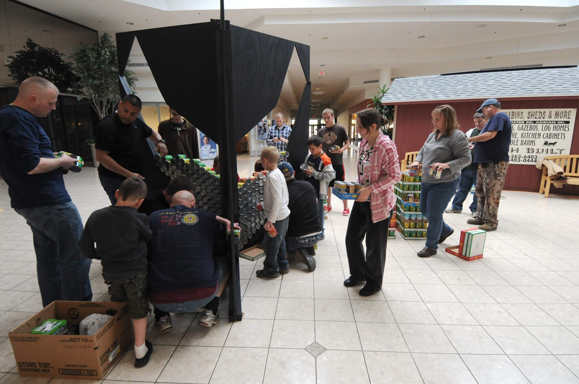 Servicemembers from the 110th Airlift Wing, Battle Creek Air National Guard Base and their families participate in the local food drive Canned Sculpture Exhibit held at Lakeview Square Mall, Battle Creek, Mich., on Sunday, April 22, 2012. A donation of over $600 was collected toward the sculpture equaling over a 1,000 cans. All food collected is donated to the Food Bank of South Central Michigan. Sculptures will be on display until Sunday, May 6, 2012. (U.S. Air National Guard Photo by Master Sgt. Sonia Pawloski/Released)