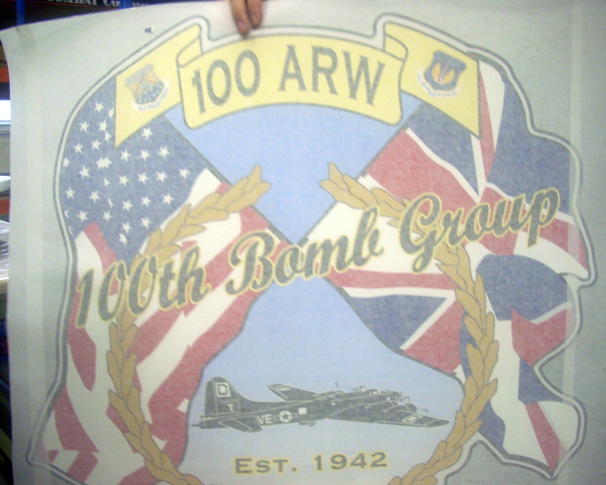 “I liked this nose art because it looked like American and English people joining together with an airplane,” said 7-year-old Hannah Smith, a photojournalist for the day. (Among many tasks, sheet metal mechanics create KC-135 Stratotanker nose art. They displayed some art for a group of base children during Job Shadow Day here April 27, 2012. Learning to be a photojournalist, like her father who works at the 100th Air Refueling Wing Public Affairs office, 2nd grader Hannah Smith captures the demonstration on her camera.) (U.S. Air Force photo/Hannah Smith)