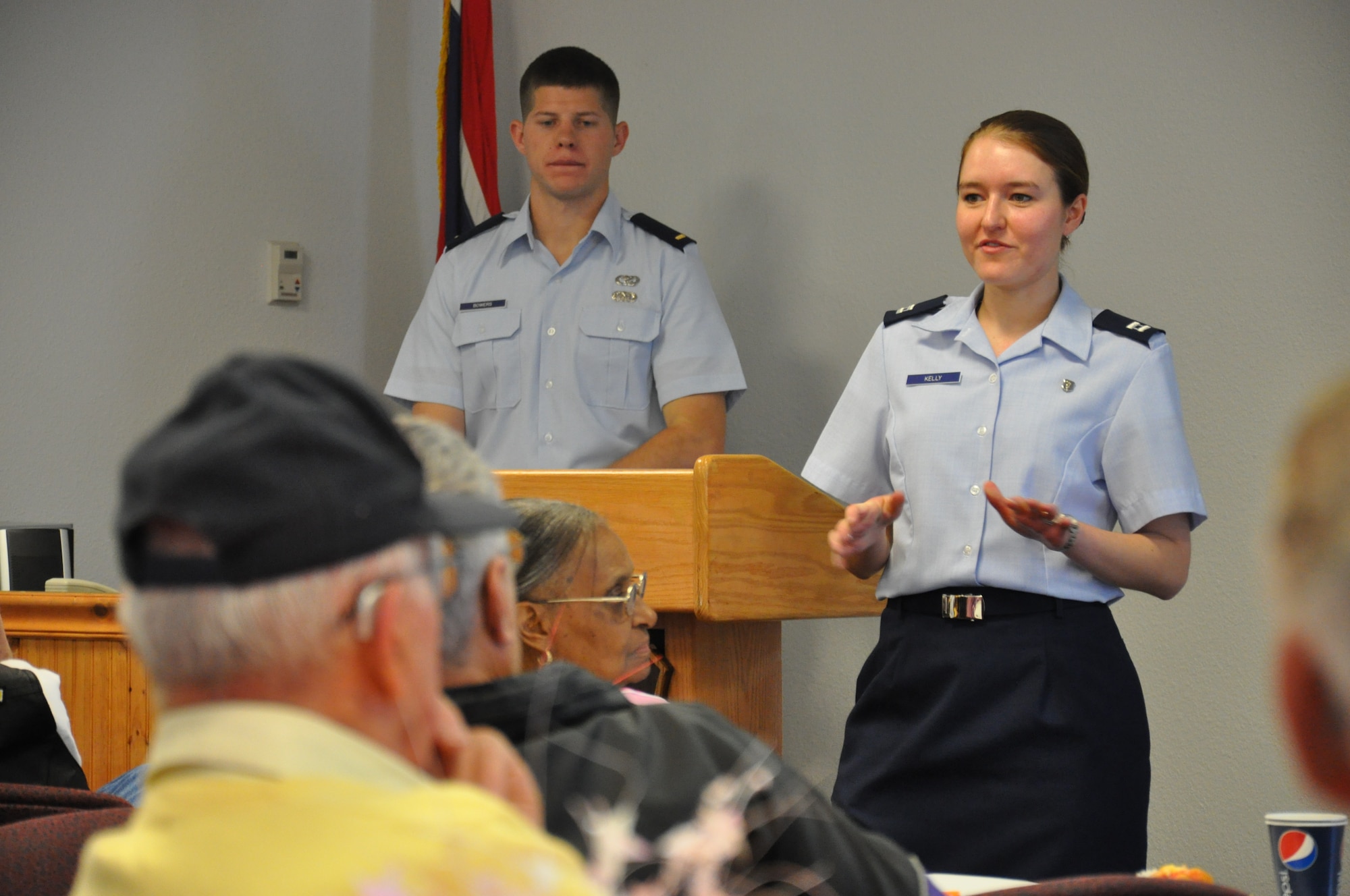 Capt. Sarah Kelly, 90th Medical Support Squadron, discusses issues related to the pharmacy with retired military members from the local community April 21 during Warren’s Retiree Appreciation Day. (U.S. Air Force photo by Airman 1st Class Dan Gage)