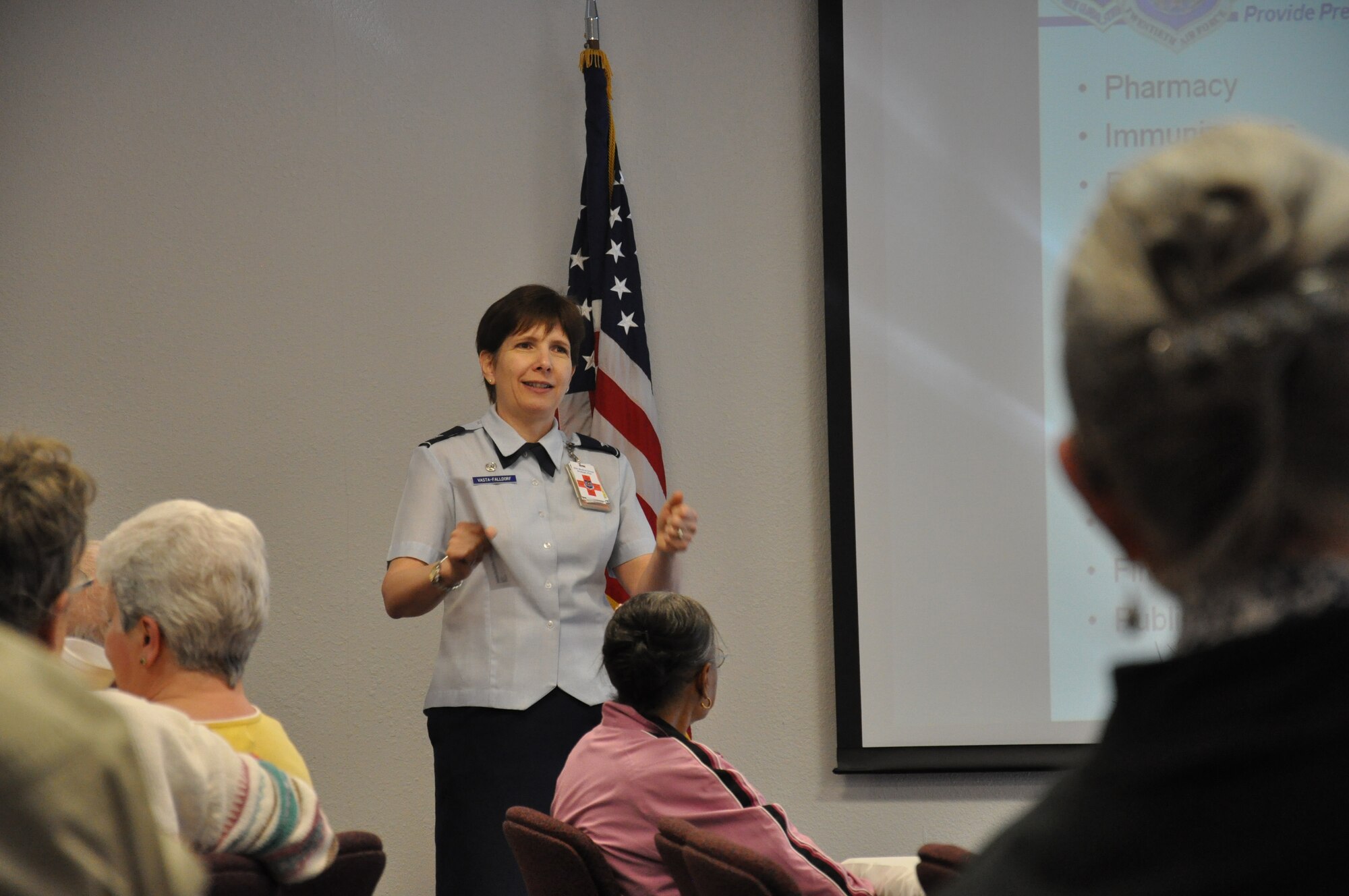 Col. Fran Vasta-Falldorf, 90th Medical Group commander, welcomes retired military members from the local community to the 90th MDG clinic and explains events and services happening throughout the morning during Warren’s Retiree Appreciation Day April 21. (U.S. Air Force photo by Airman 1st Class Dan Gage)