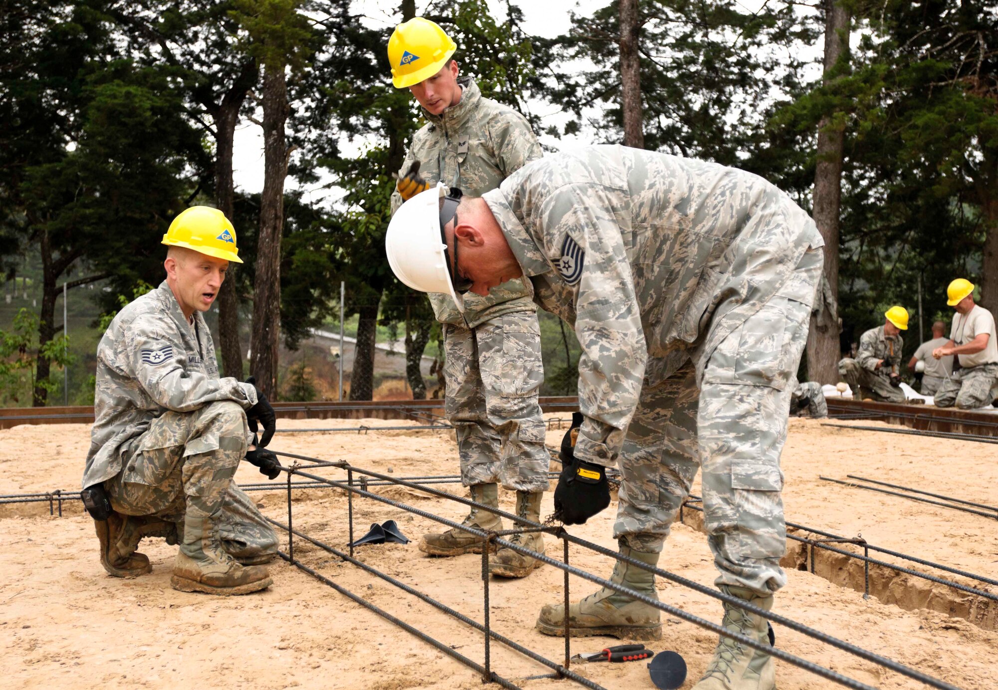 Staff Sgt. Samuel Miller, left, Senior Airman Aaron Green, center, and Tech. Sgt. Jeffrey Crowder, both members of the 188th Civil Engineering Squadron of the Arkansas Air National Guard, deployed to Guatemala in support of Beyond the Horizon 2012 (BTH). They are building a rebar form for use in the foundation of a women’s clinic. The clinic is a BTH military engineering exercise designed to provide training for service members and medical resources to Guatemalan civilians. The 188th CES, which is part of the 188th Fighter Wing, sent three teams in three separate two-week rotations to Guatemala. (U.S. Army photo by Spc. Anthony D. Jones)