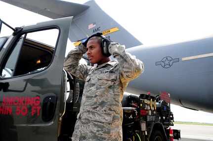 Airman 1st Class Rodrick Defreitas puts his headset on prior to refueling a C-17 Globemaster III at Joint Base Charleston - Air base, April 18. The C-17 can hold up to 35,546 gallons of fuel and can carry a maximum of 17,900 pounds and land on runways as short as 3,500 feet which is crucial to resupplying remote areas from the air or ground. Defreitas is from the 628th Logistics Readiness Squadron, Fuels Mobility Support Flight.  (U.S. Air Force photo/ Staff Sgt. Nicole Mickle)  




