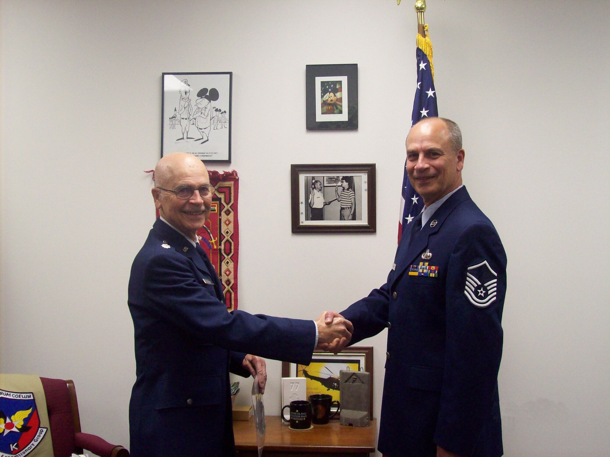 Master Sgt. Brian Mohlman makes his final oath of enlistment on Friday, April 13, 2012 at the Battle Creek Air National Guard Base, Mich. Master Sgt. Mohlman is sworn in by Lt. Col. Harold Mohlman (retired), his father. (U. S. Air National Guard Photos courtesy of 110th Force Support Squadron Master Sgt. Brian Mohlman/Released)